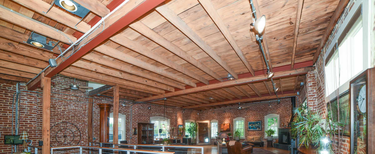 Large Downtown Converted Industrial Loft With High Ceilings And Brick Walls