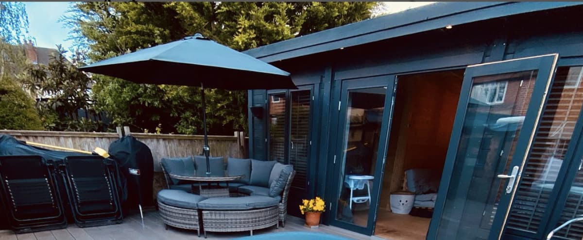 Log Cabin and Decking area with Hot Tub, BBQ/Outdoor Kitchen and modern seating area/table with umbrella in Surrey Hero Image in Worcester Park, Surrey, 