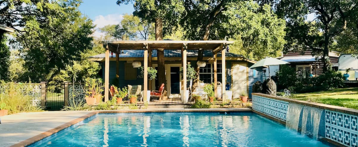 Funky Retro Gameroom with Swimming Pool, Pergola and Backyard Vintage Trailer in a Country Setting in Austin Hero Image in West Oak Hill, Austin, TX