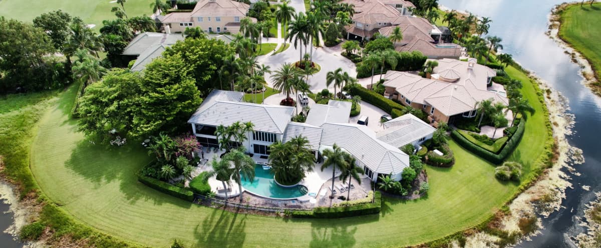 Stunning Custom Home Lake Side. in West Palm Beach Hero Image in Pineapple Park / Ibis, West Palm Beach, FL