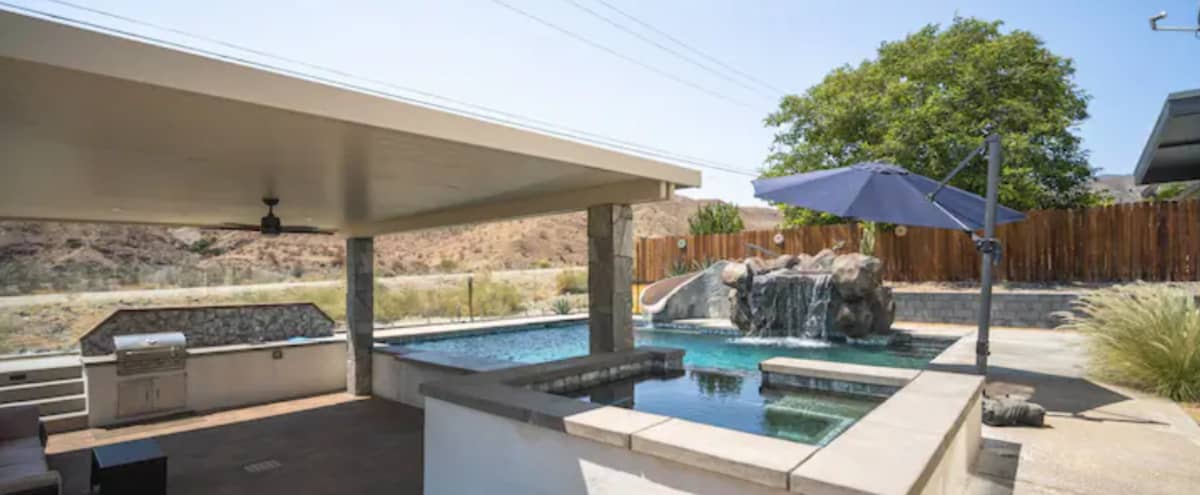 Desert Back Yard Retreat with Waterslide, Grotto, Huge Pool in Cathedral City Hero Image in undefined, Cathedral City, CA
