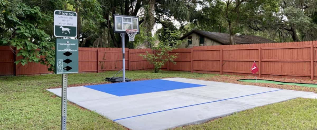 Fully Fenced  Backyard With a Basketball Court and Mini Golf in Tampa Hero Image in Lowry Park North, Tampa, FL