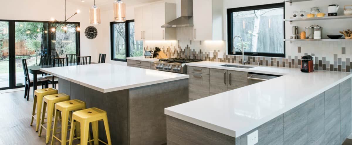 open kitchen dining living space full of natural light warm industrial modern