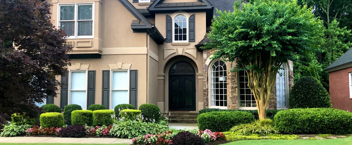 This picture perfect transitional-styled home is nestled ...