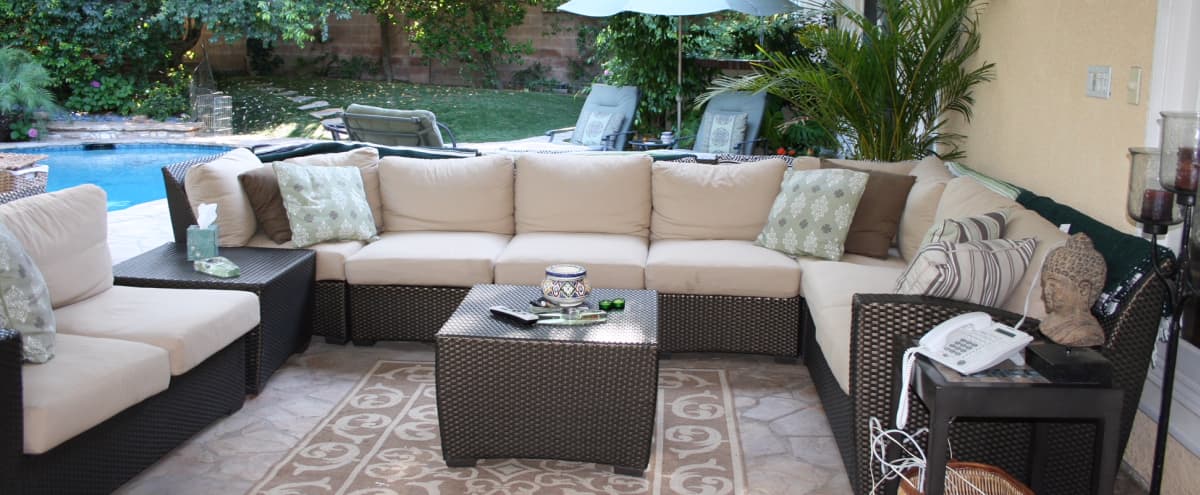 Suburban Outdoor Garden Space With Covered Patio With Heaters And