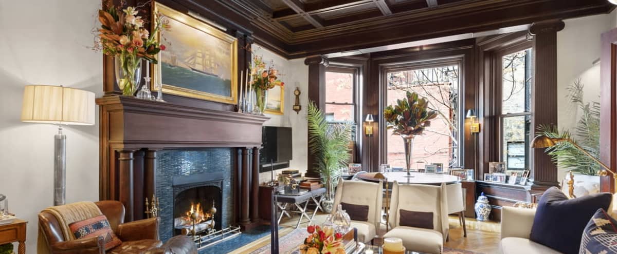 Paneled Pre War Parlor Floor of Townhouse with fireplace in New York Hero Image in Midtown Manhattan, New York, NY