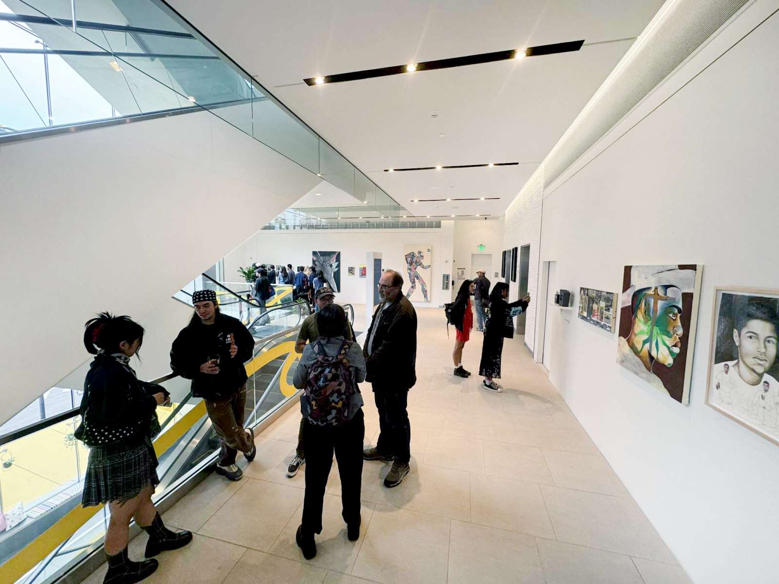Guests networking in a bright gallery space