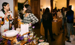 Two women networking at a party in a Peerspace location