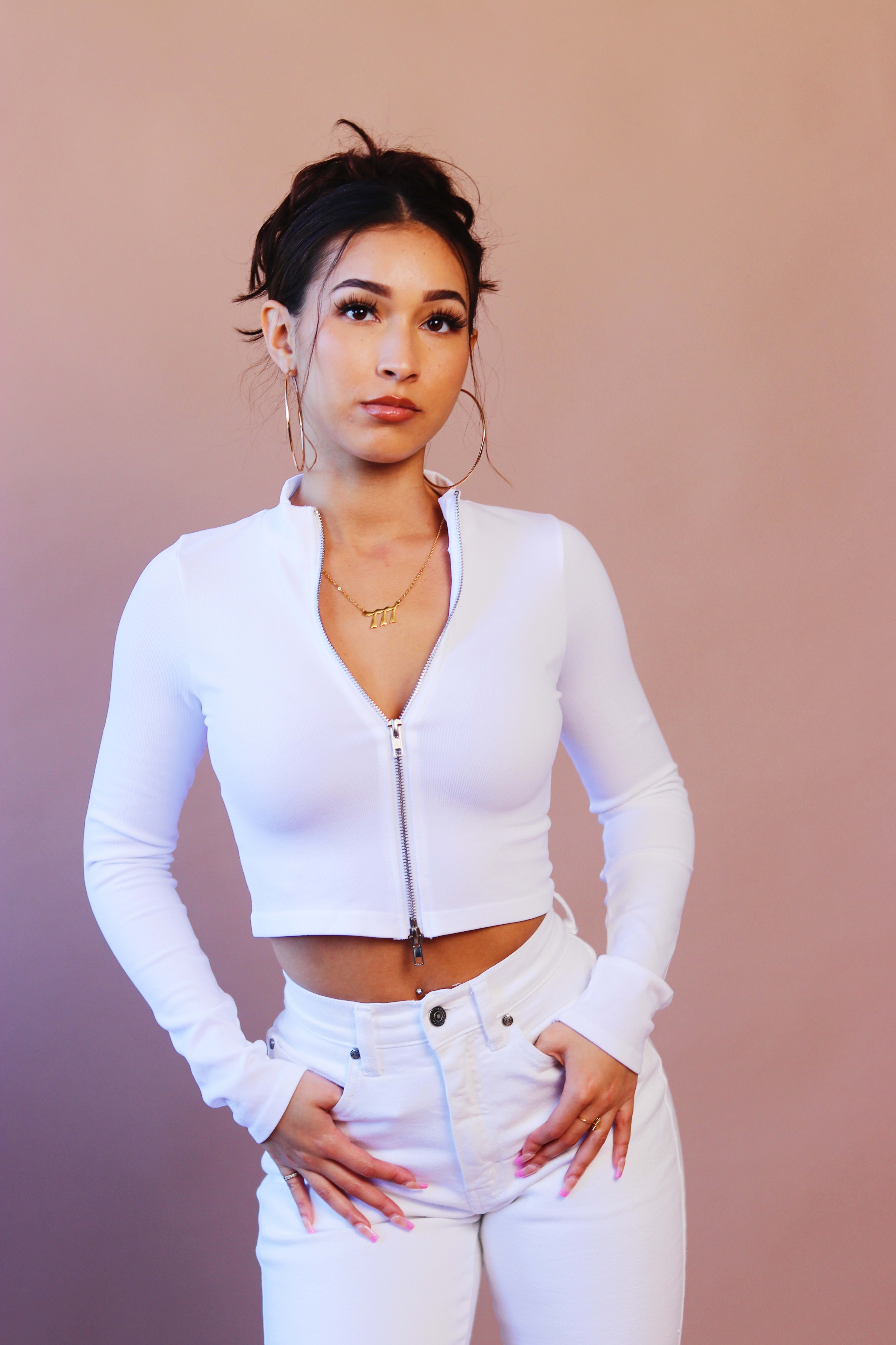 A fashion photo shoot with a woman in white.