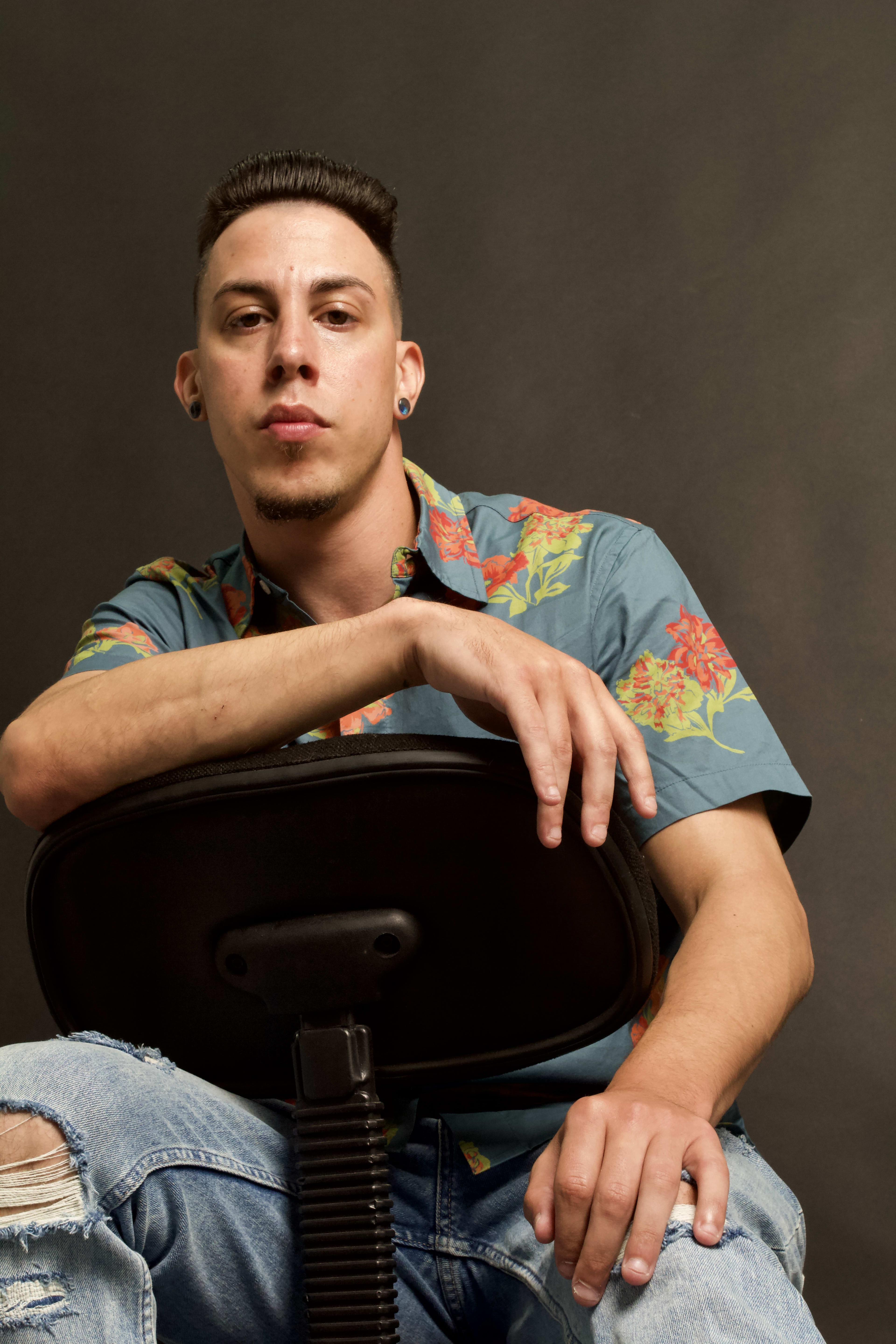 Portrait Of A Man Sitting On A Chair With His Hand On The Back By Russ Brown In New York Ny