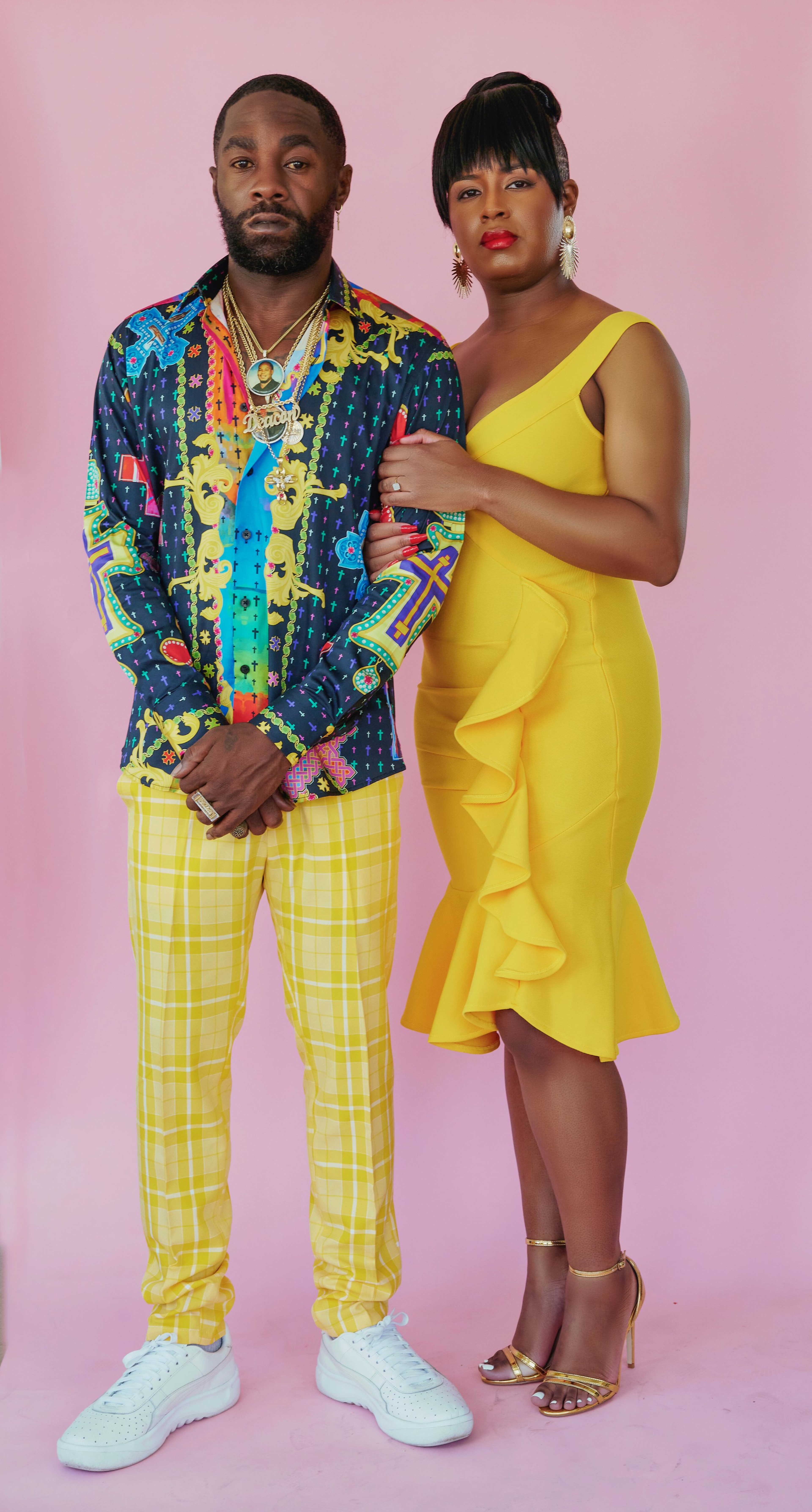 A woman and a man posing together during a photoshoot.