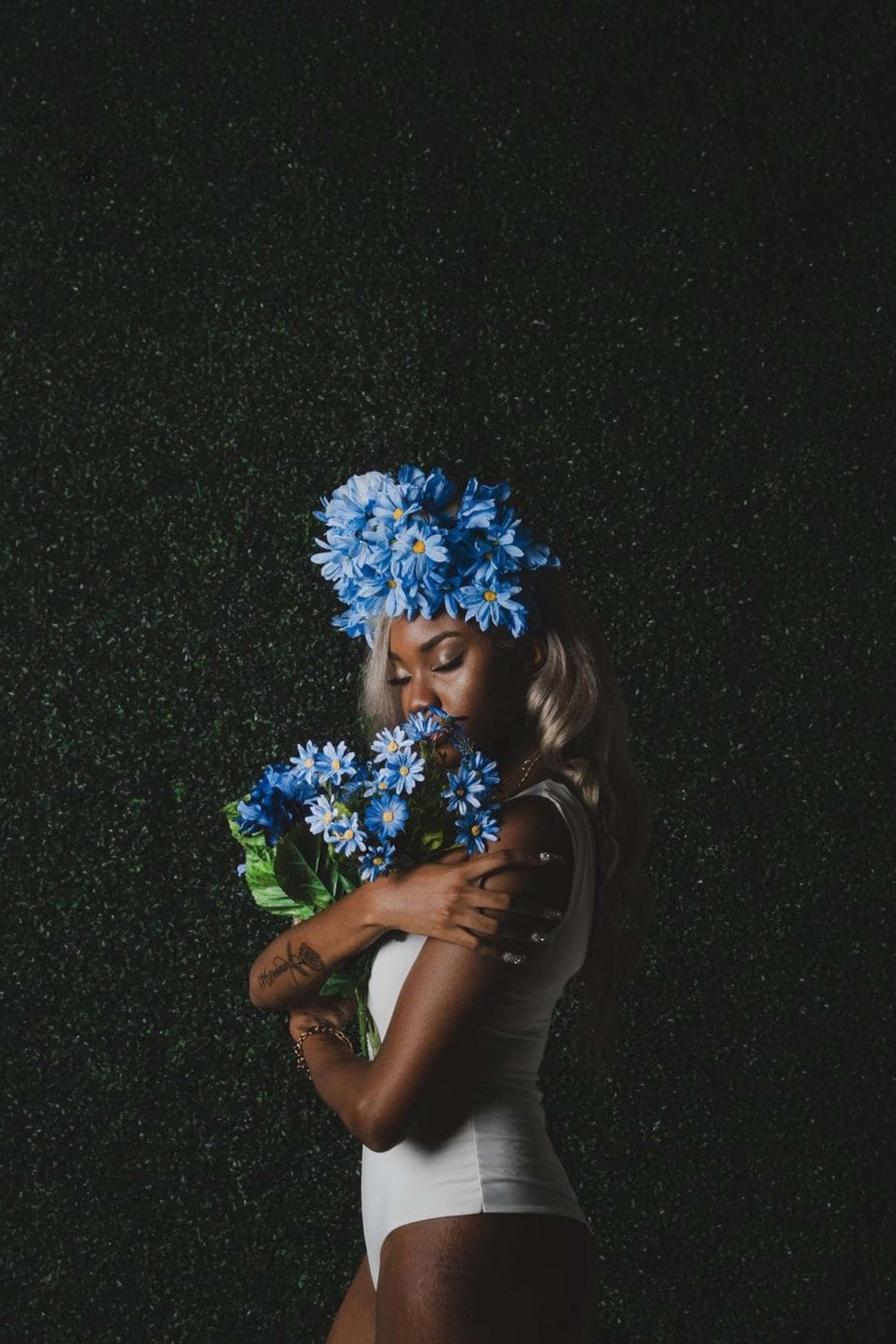 Garden themed photo shoot with blue flowers