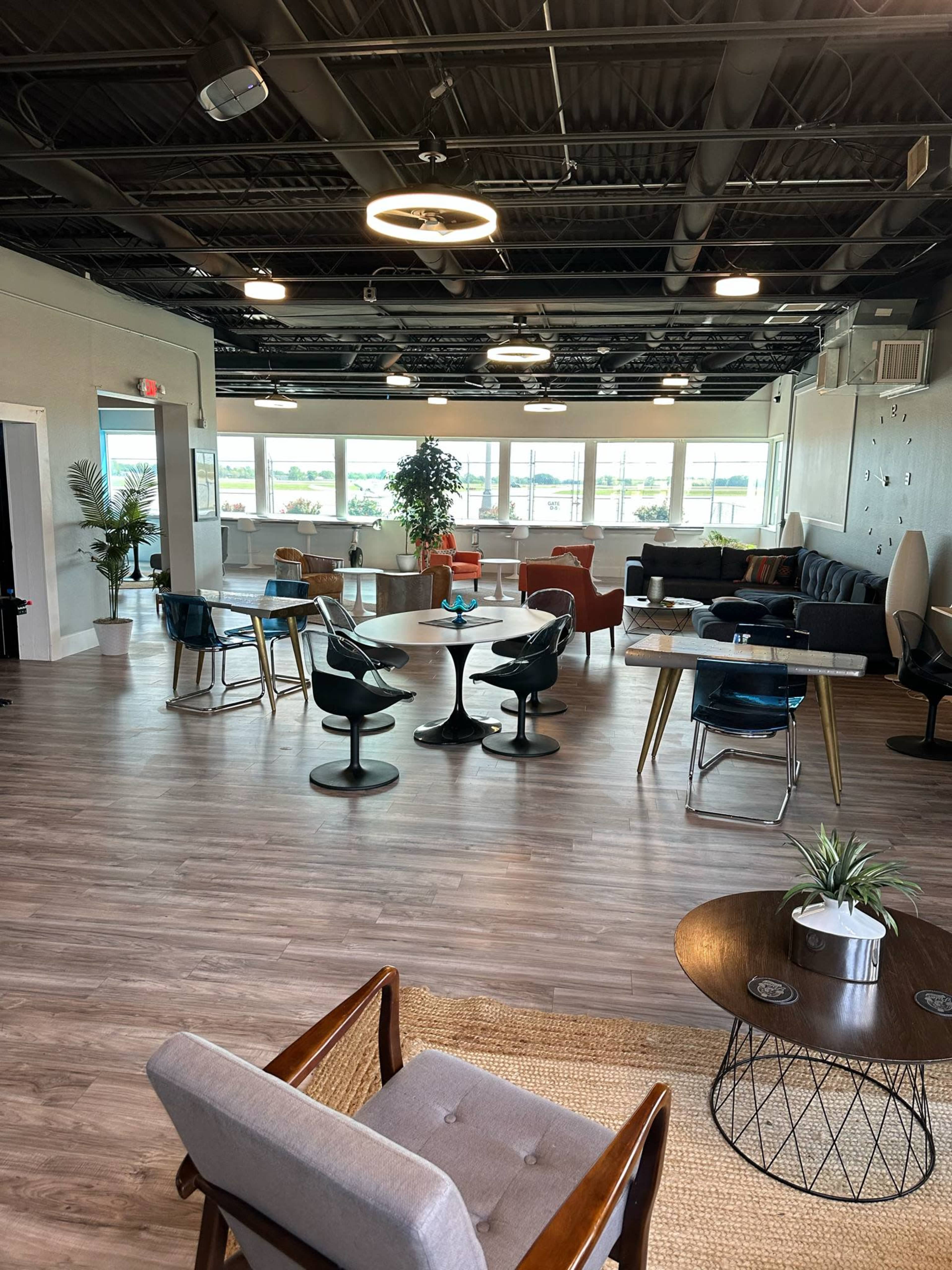 Modern Aviation Lounge with Runway Views + Retro Arcade Vibe Image in Wood River Township, East Alton, IL
