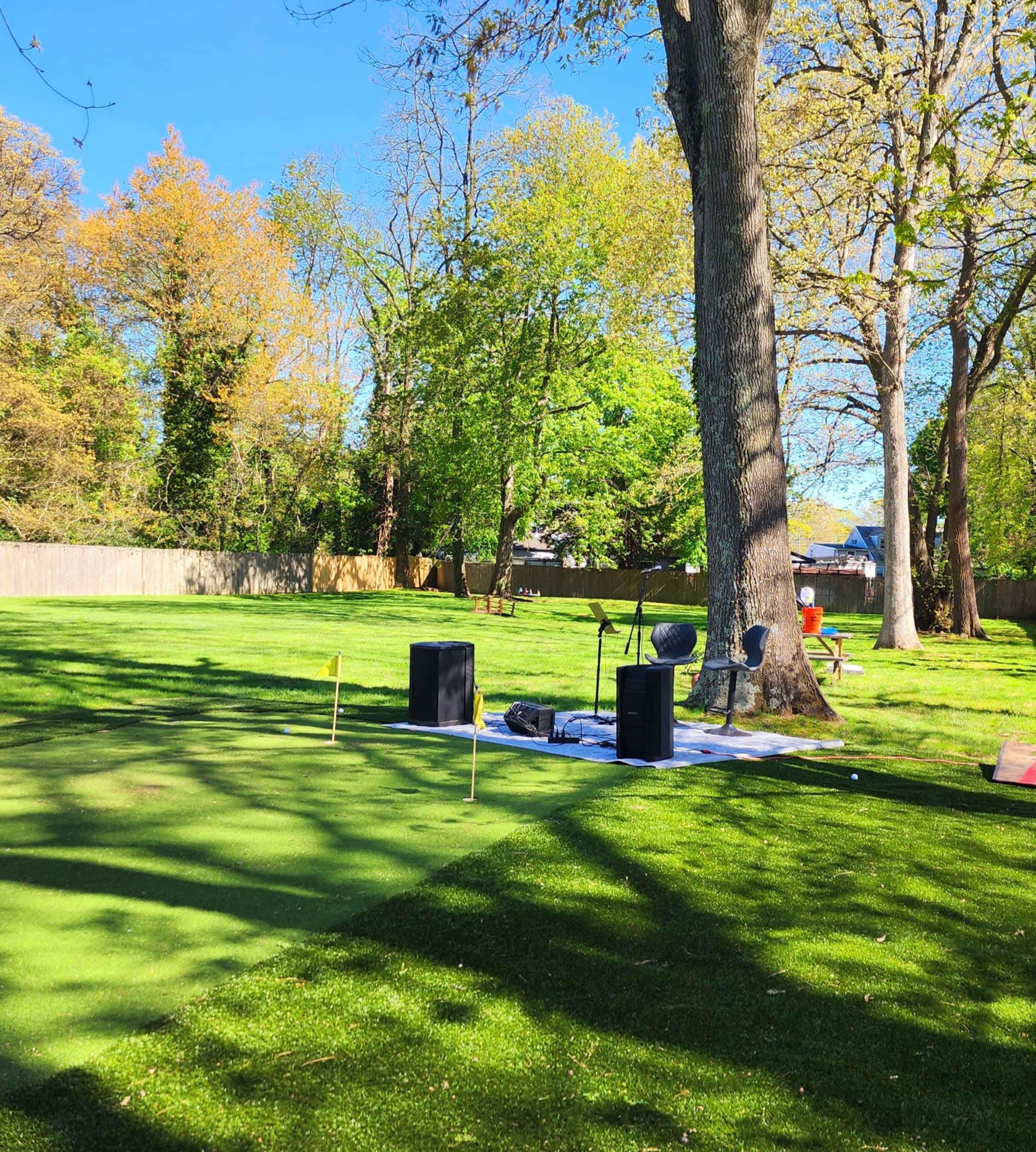 Elegant Backyard Escape with Ambient Lighting with Stage Image in Babylon, Wheatley Heights, NY
