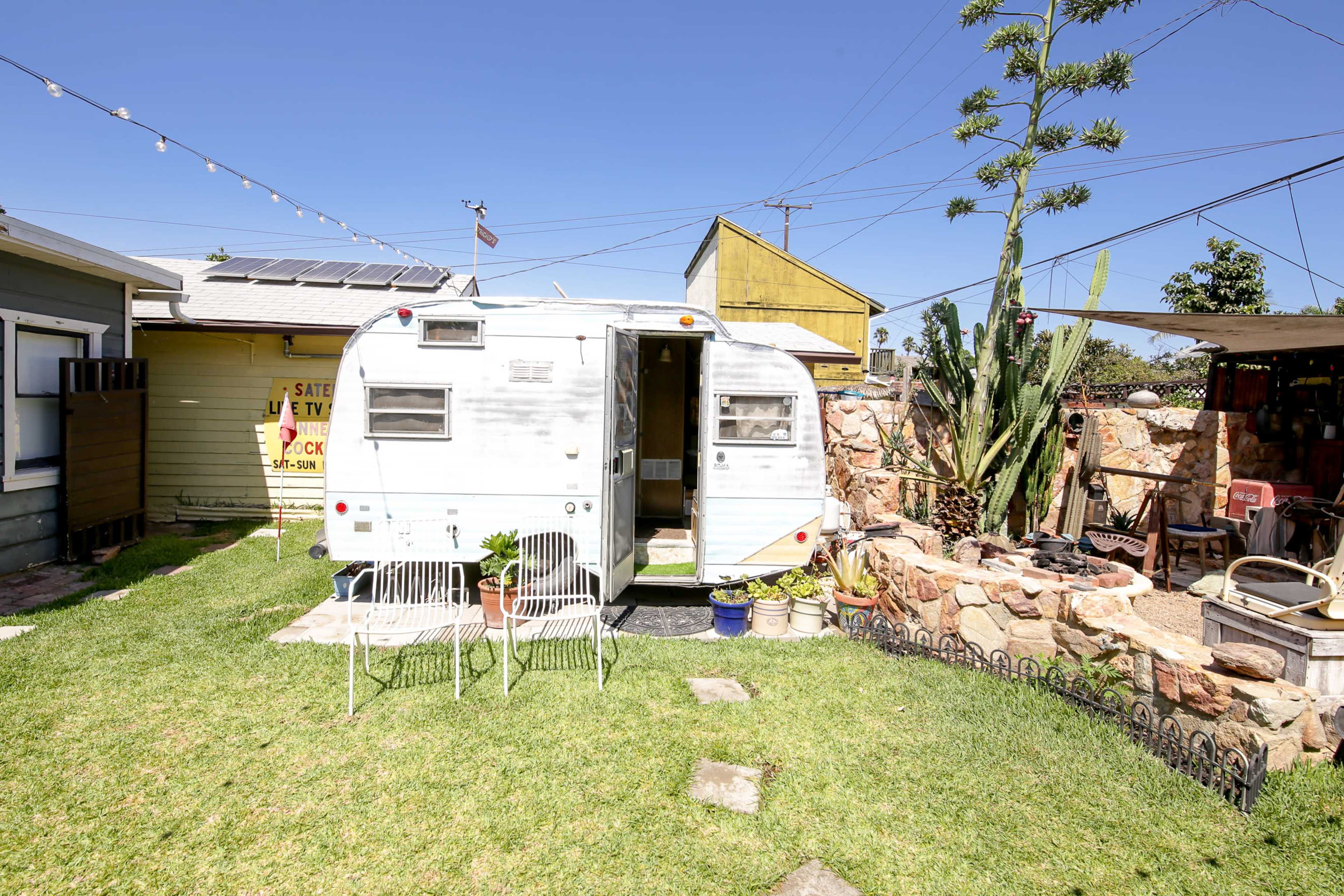 Vintage Backyard Stone Cantina, Trailer, and Firepit Image in Rose Park, long beach, CA