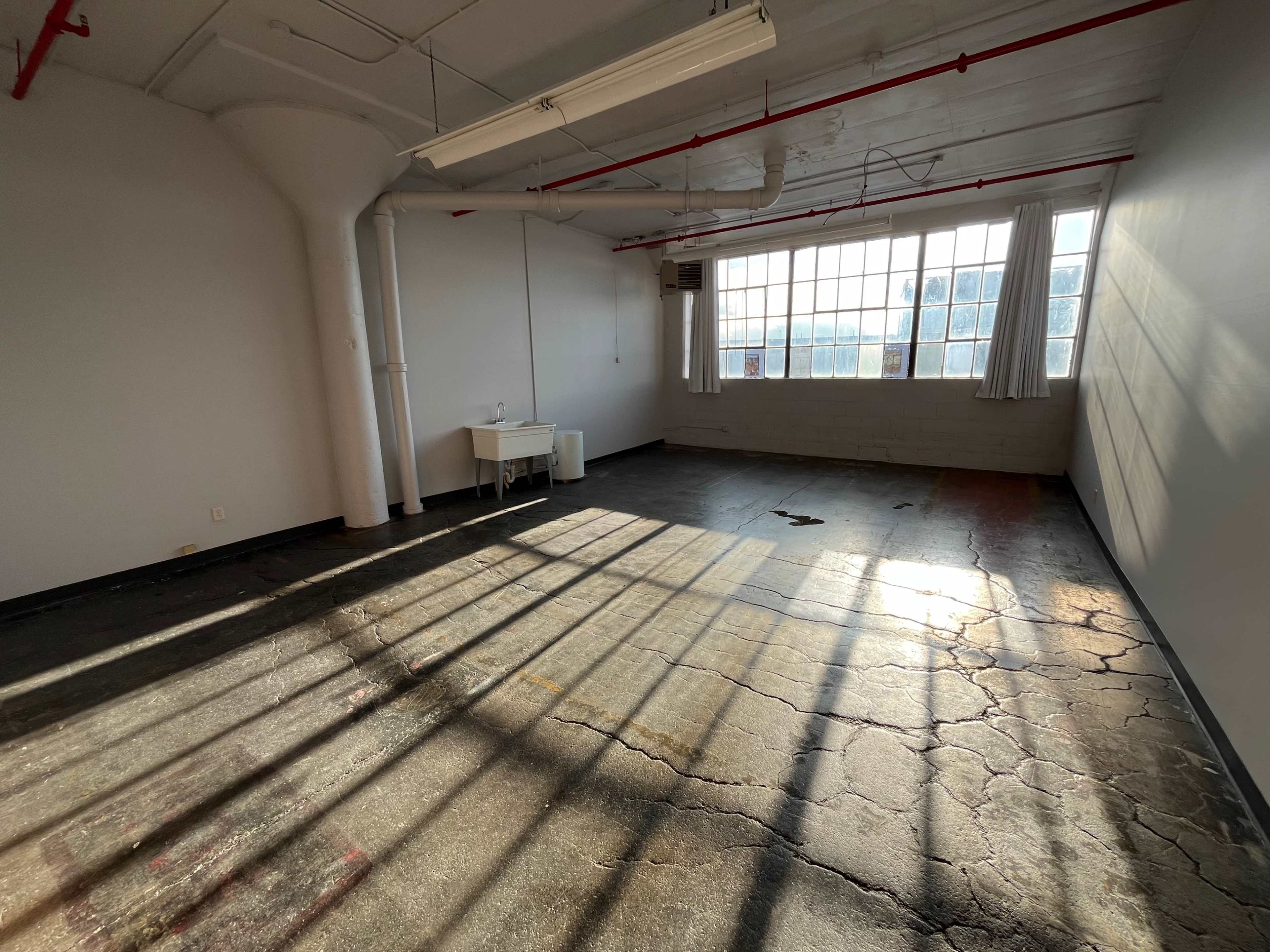 Natural Light-Filled Warehouse Studio with Harbor Skyline View Image in Bay View, Milwaukee, WI