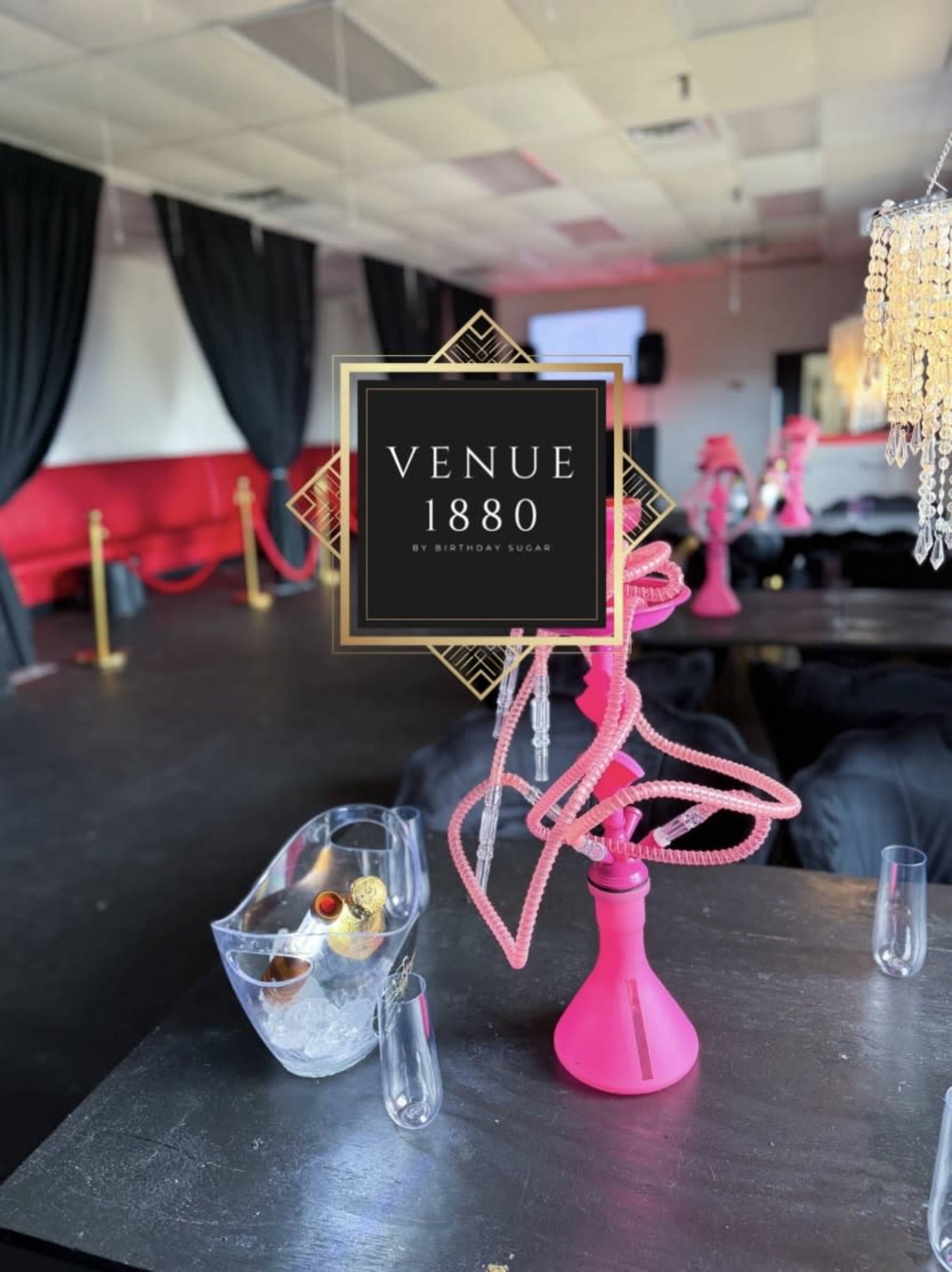 The image shows a modern event space with pink hookahs on tables, elegant decor, and a sign indicating it is called "Venue 1880."