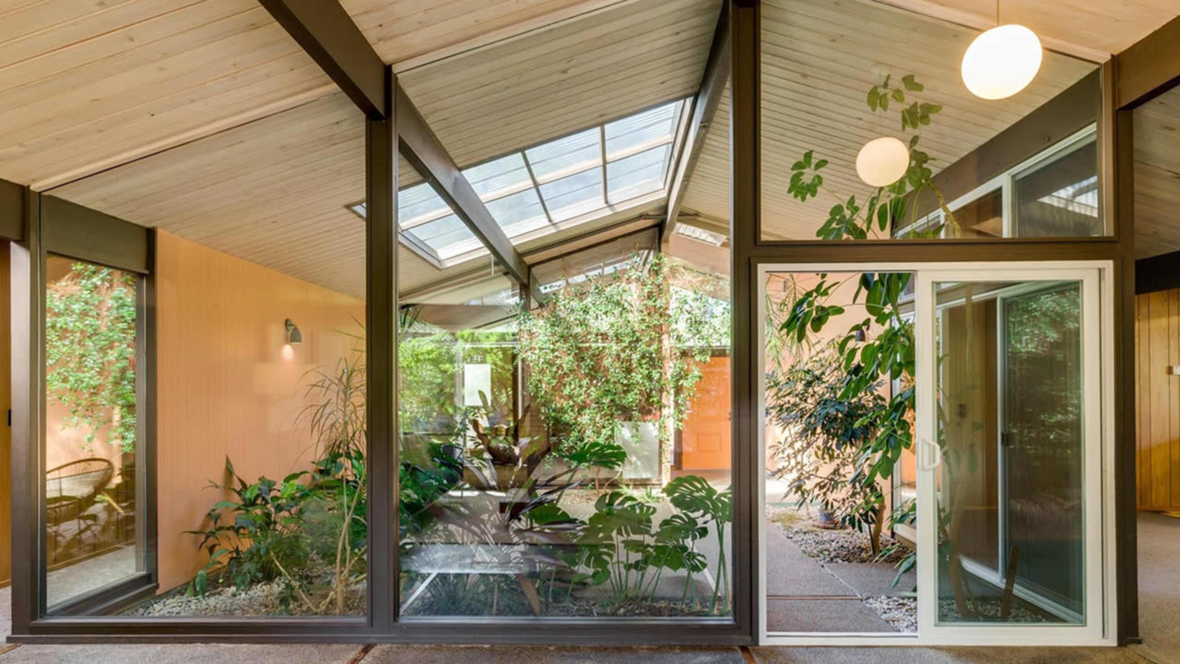 Mid-Century Rummer Atrium House with Lush Indoor Garden Image in Garden Home-Whitford, Portland, OR