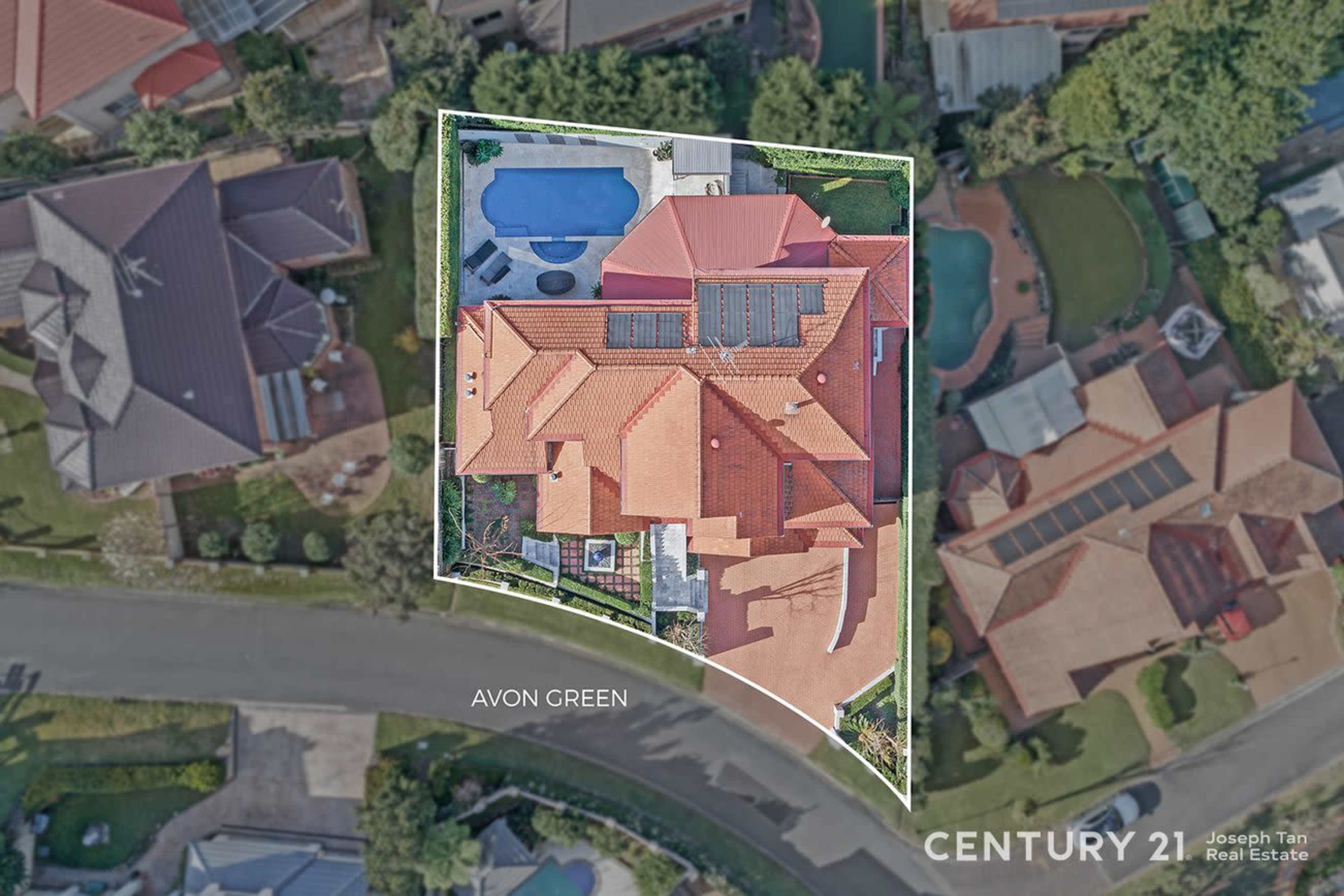 The image shows an aerial view of a residential property with a swimming pool, solar panels, and landscaped outdoor areas.