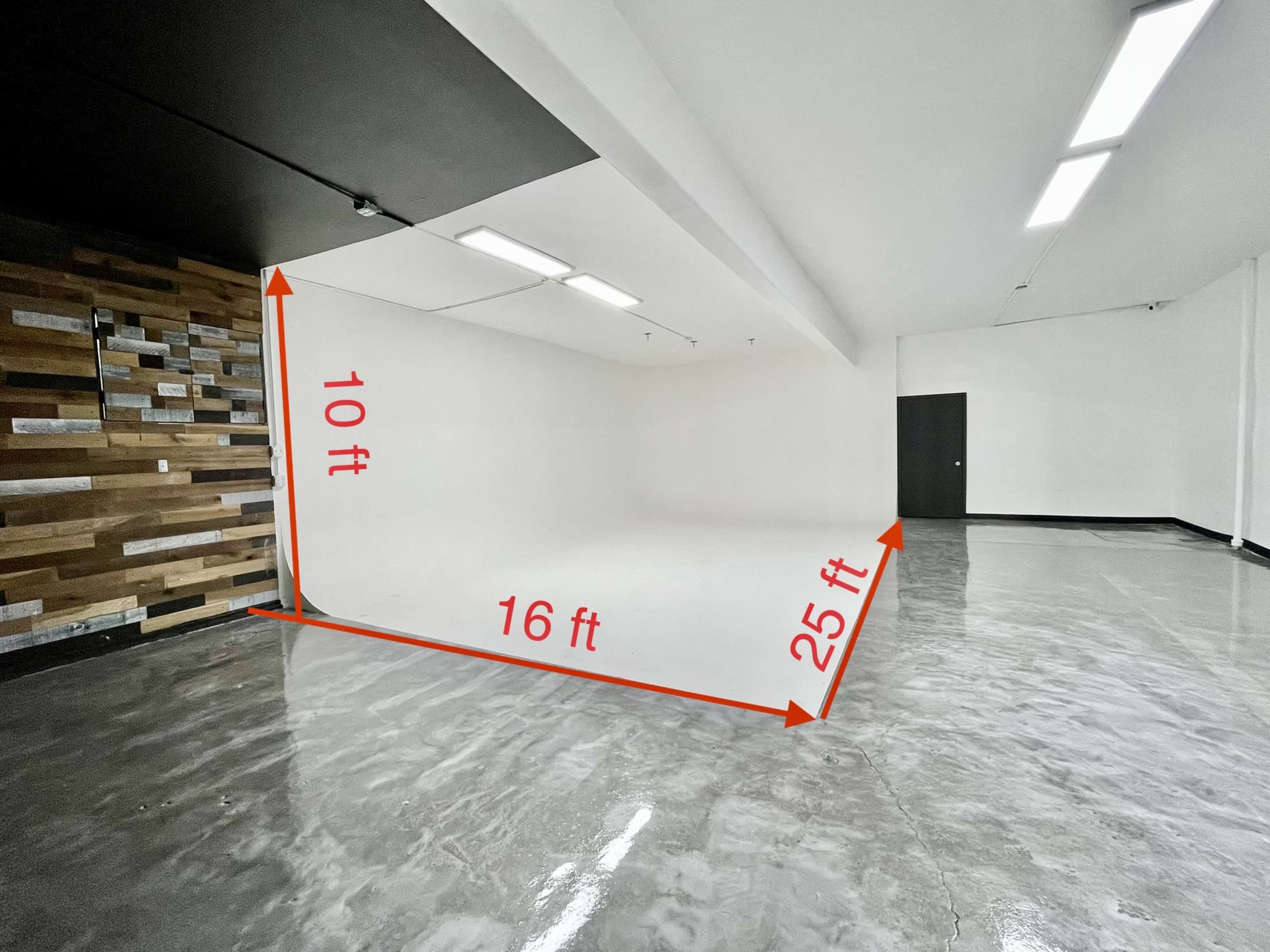 The image shows an empty room with a polished concrete floor, plain white walls, and dimensions marked as 10 feet high, 16 feet wide, and 25 feet long.