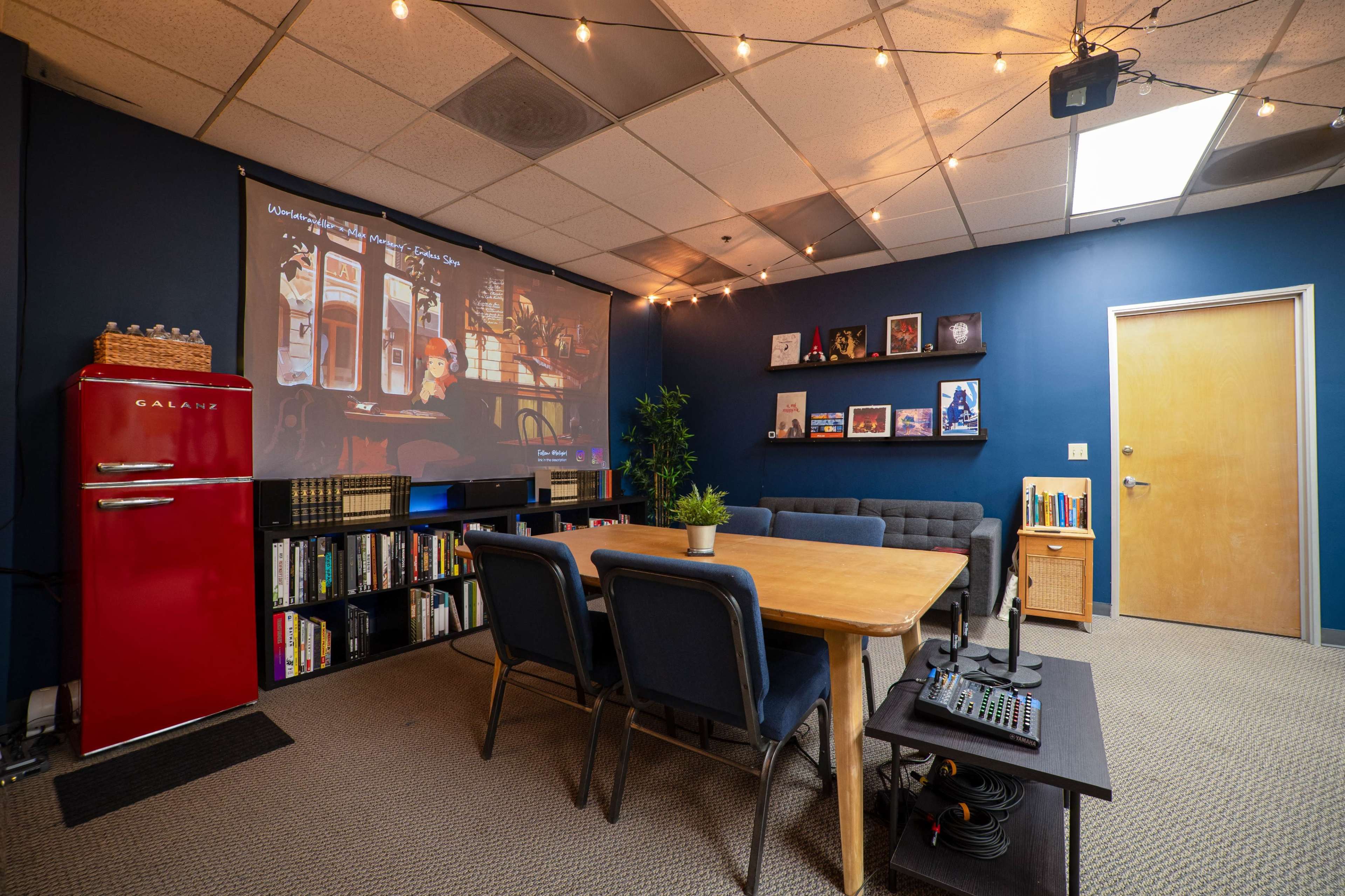 Cozy, Warm Meeting Space with Projector and Writing Materials Image in Northside, Riverside, CA