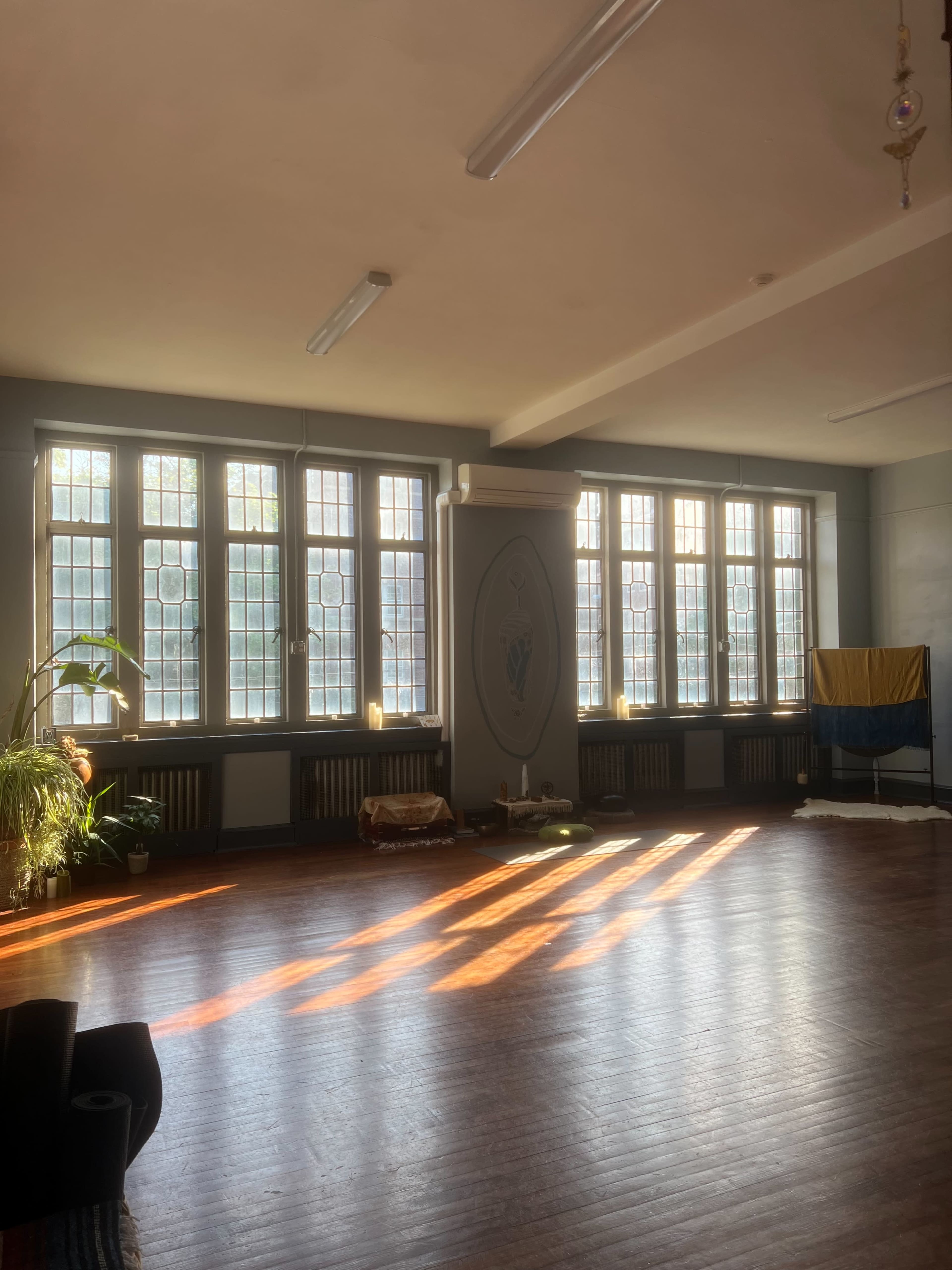 Sunlit Church Yoga Studio with Beautiful Sanctuary Windows Image in Mount Airy, Philadelphia, PA