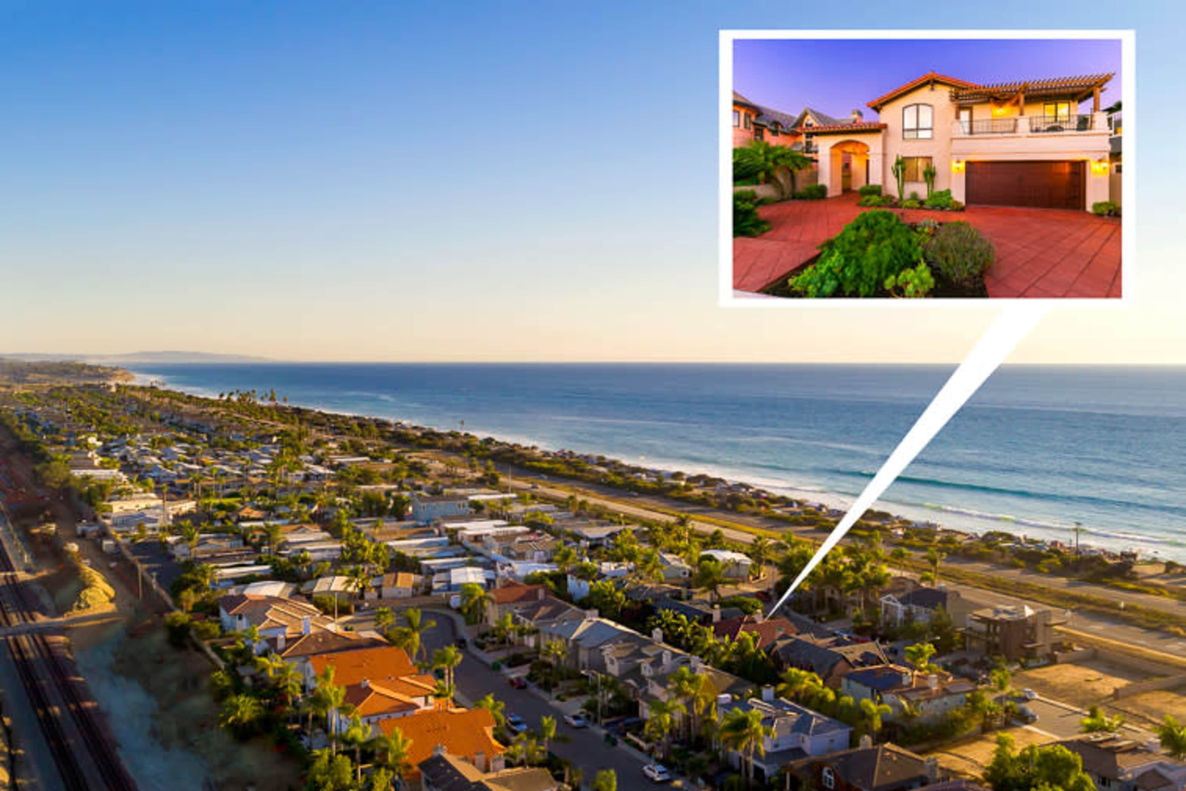 A coastal residential area with beachside homes and a view of the ocean, highlighting one property in an inset.