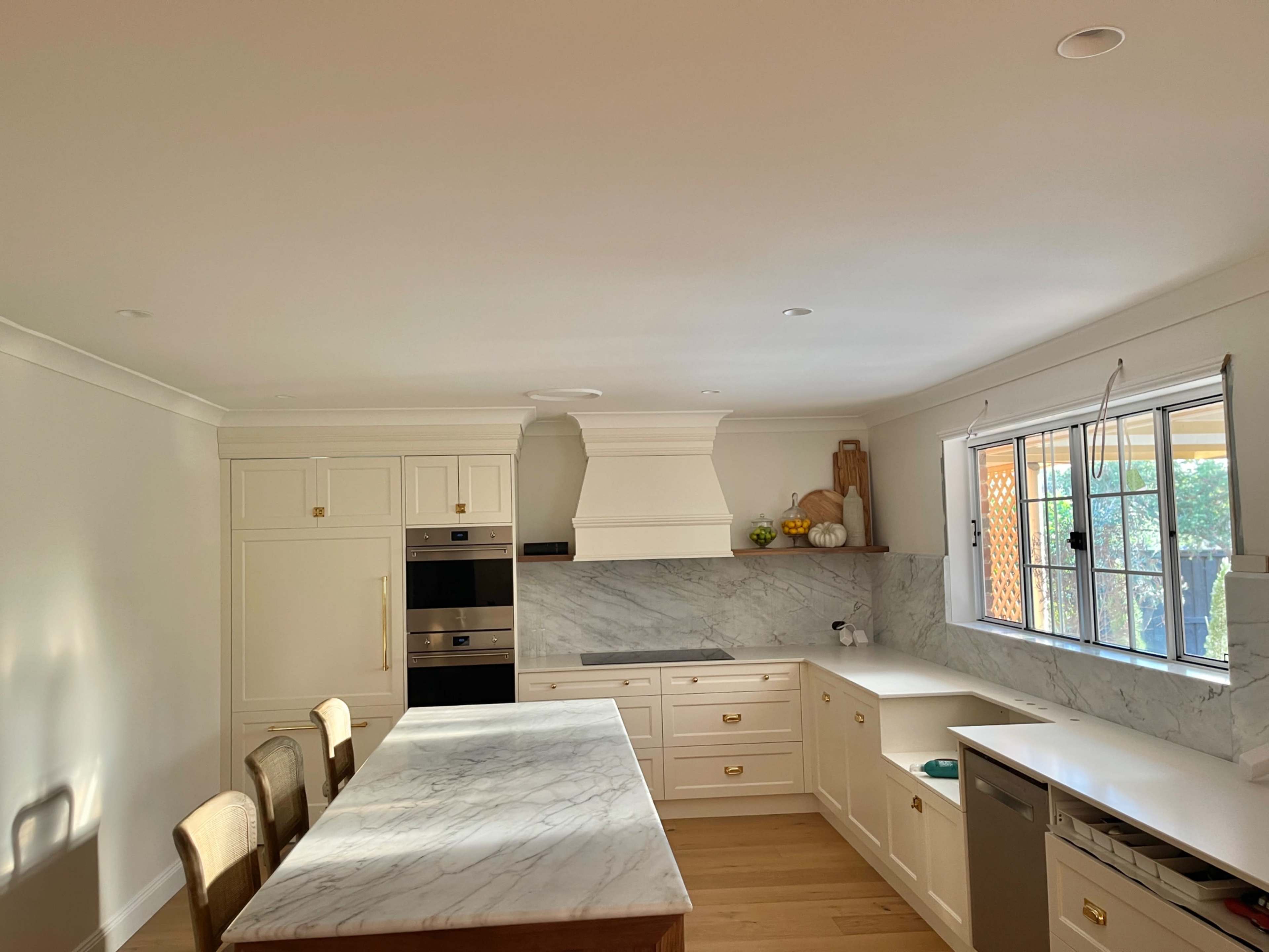 Studio McGee Style Kitchen | Hamptons | Farmhouse | Cottage | Neutral Colour Palette | American Oak Island | Marble Benchtops and backsplash | Raw Brass Hardware & Fixtures Image in East Maitland, East Maitland, NSW