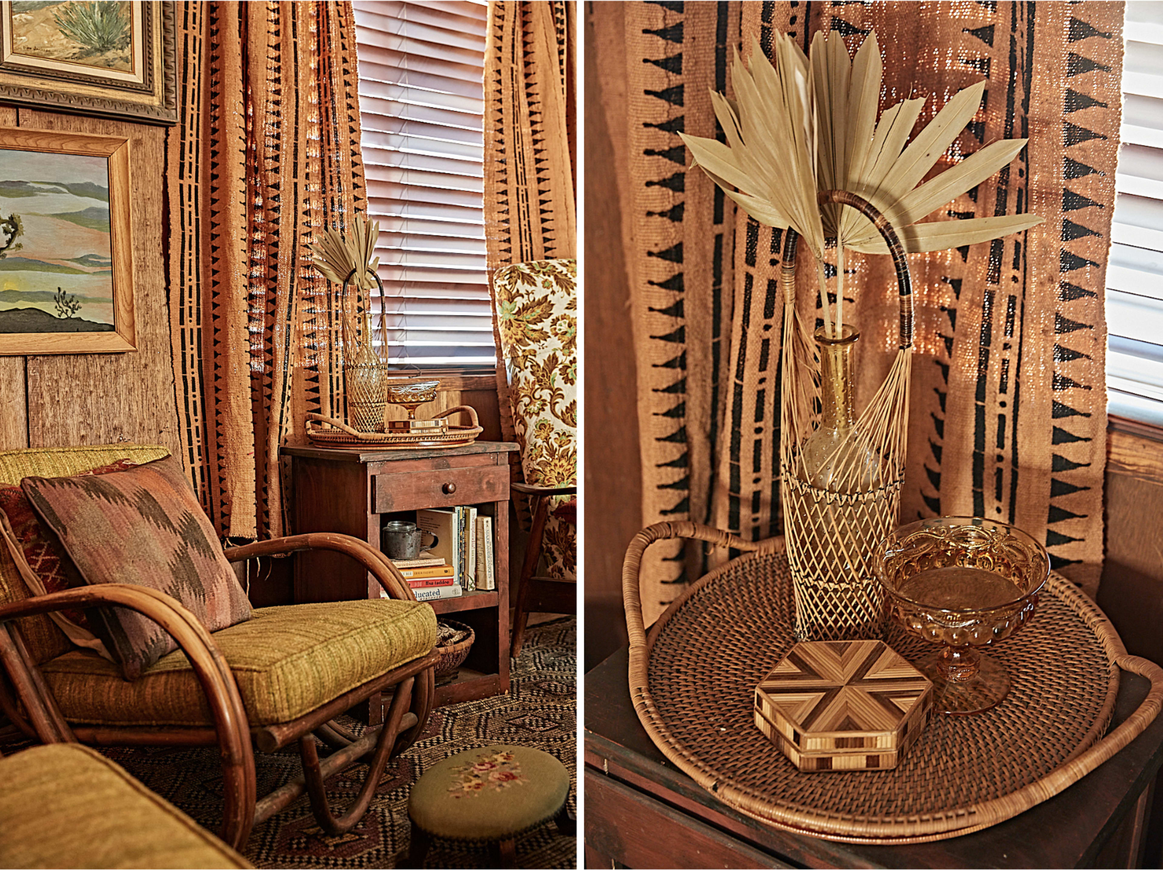 A cozy interior featuring a rattan chair, wooden furniture, decorative plants, and patterned textiles.