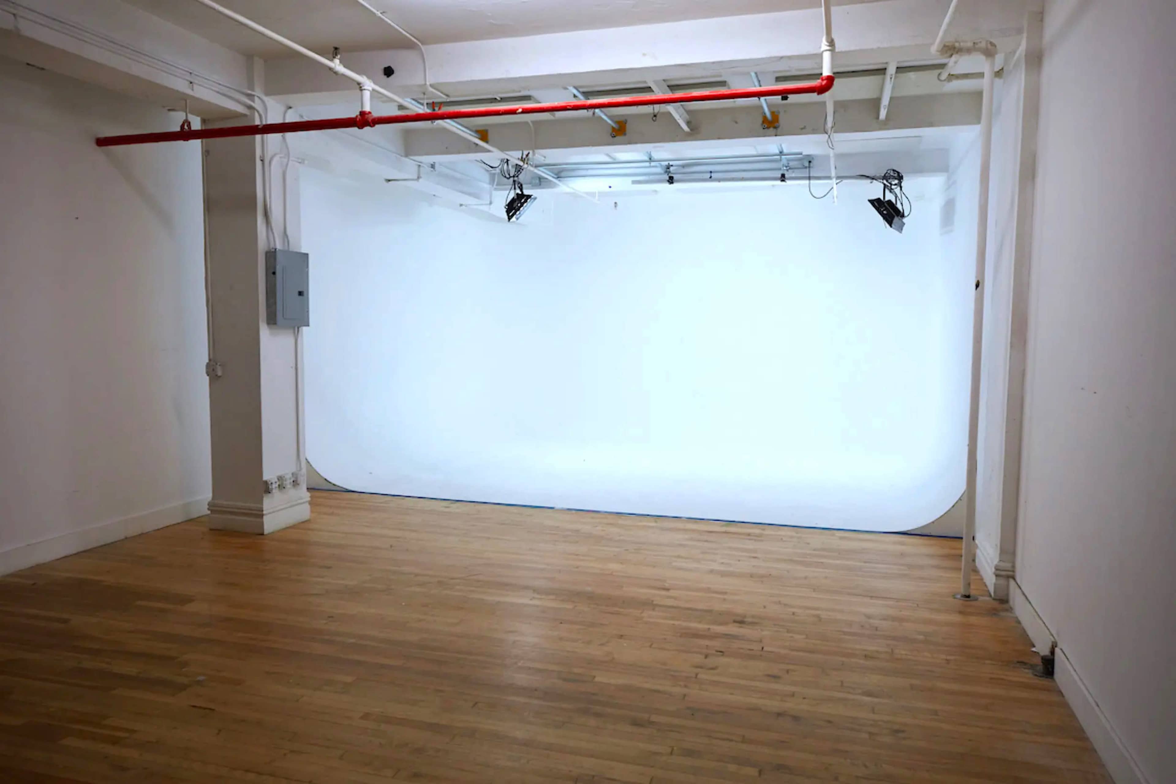 Chelsea Manhattan Cyc Walls Sound Stages w/ a Brick Wall Living Room Stage Image in Midtown Manhattan, New York, NY