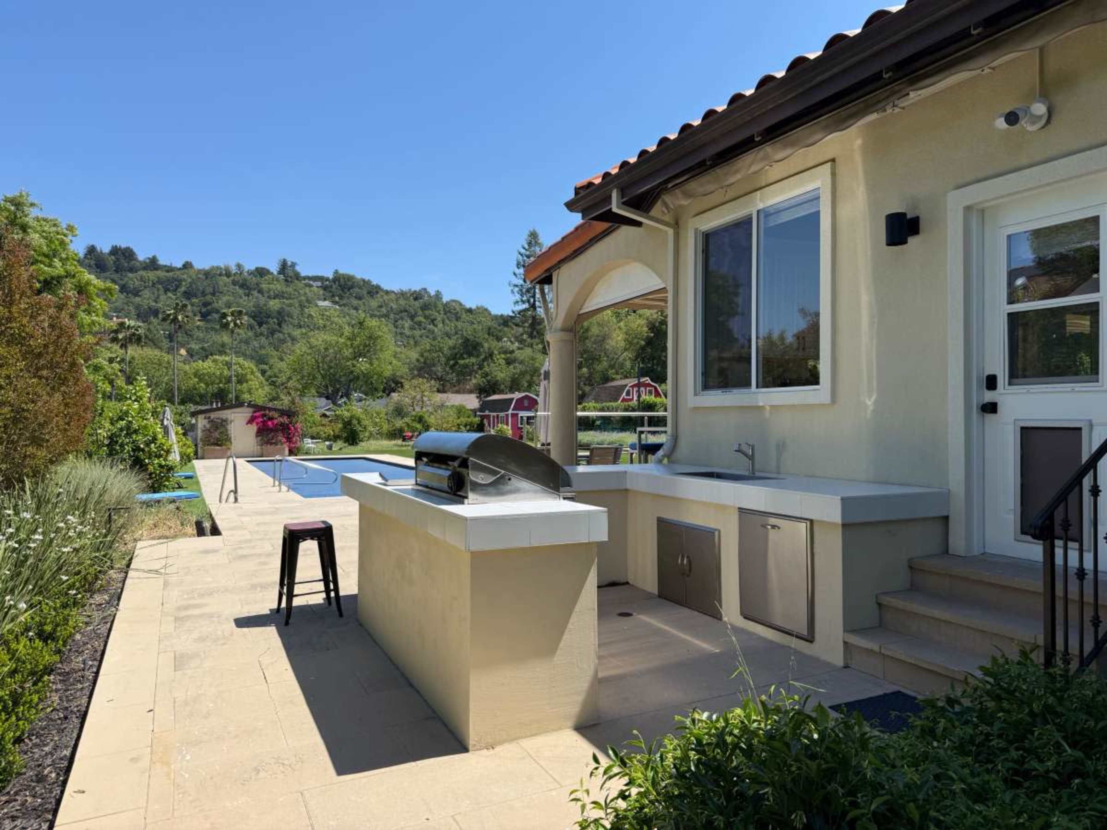 lux estate- circle driveway, sprawling pool, and patio setting.  1 flat acre.  Central Marin! Image in , SR, CA