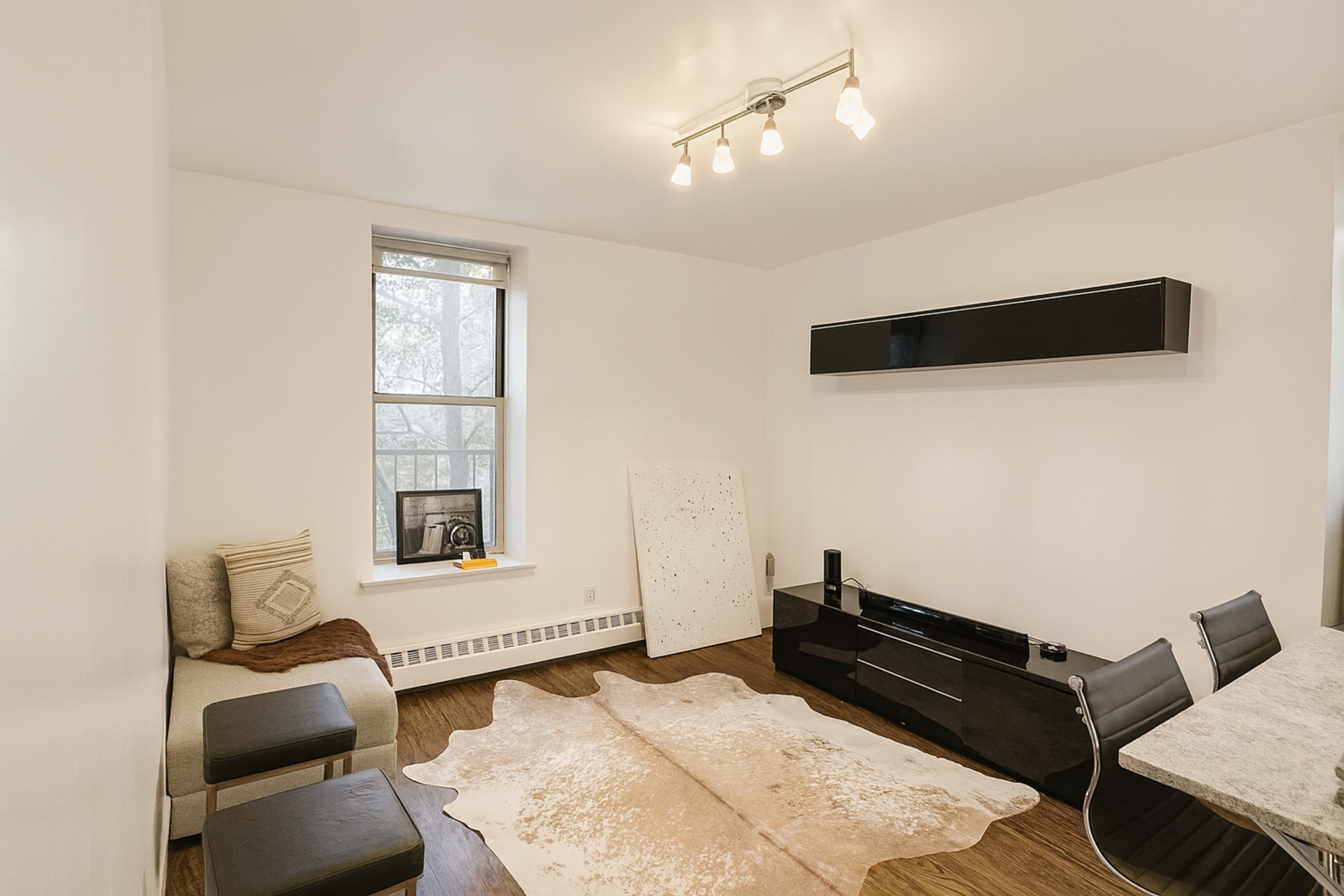 Modern Harlem Hideaway Apartment with Warm Lighting and Artistic Touches Image in West Harlem, New York, NY