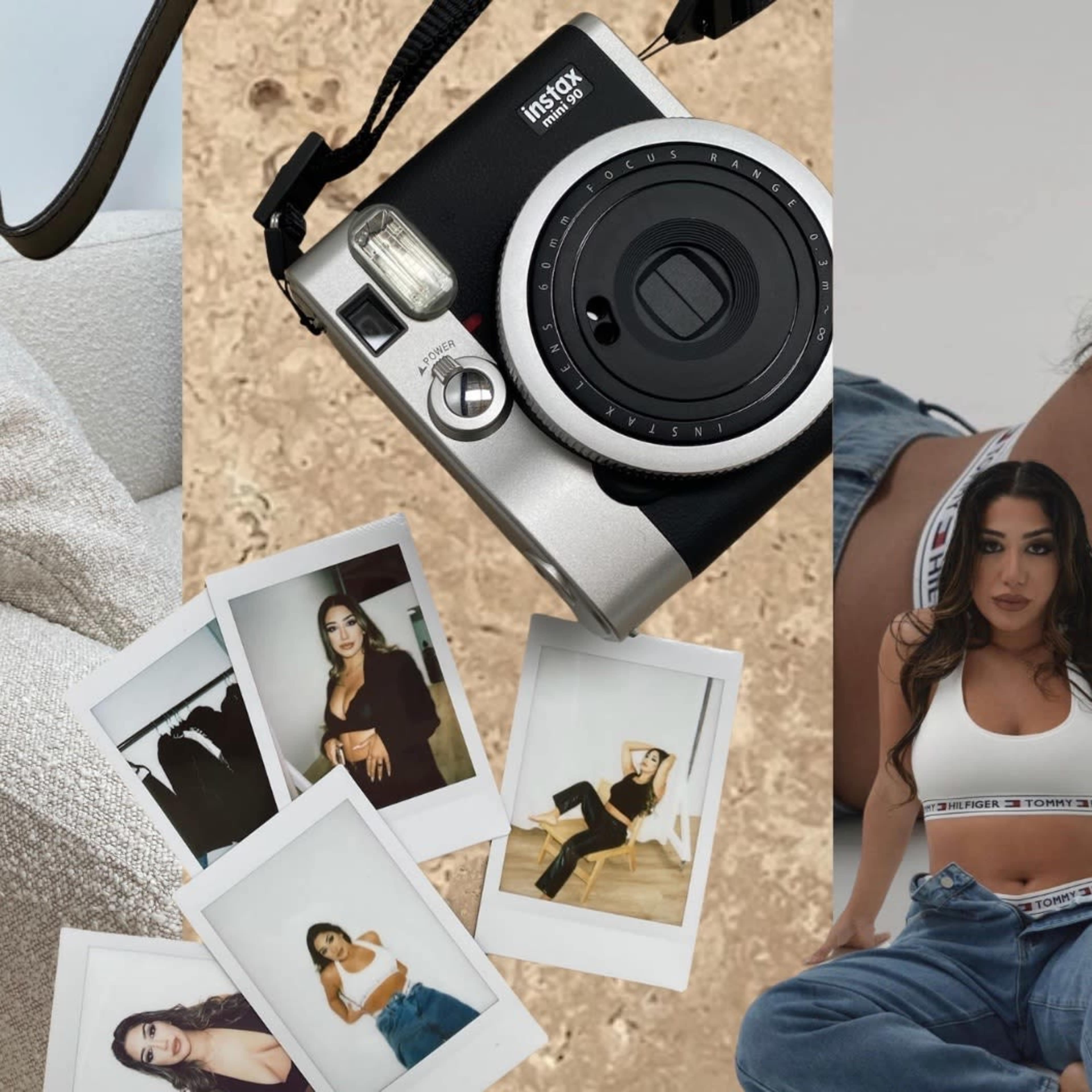 A black instant camera positioned above several polaroid photos of a woman, all displayed on a textured background with a piece of furniture in the corner.