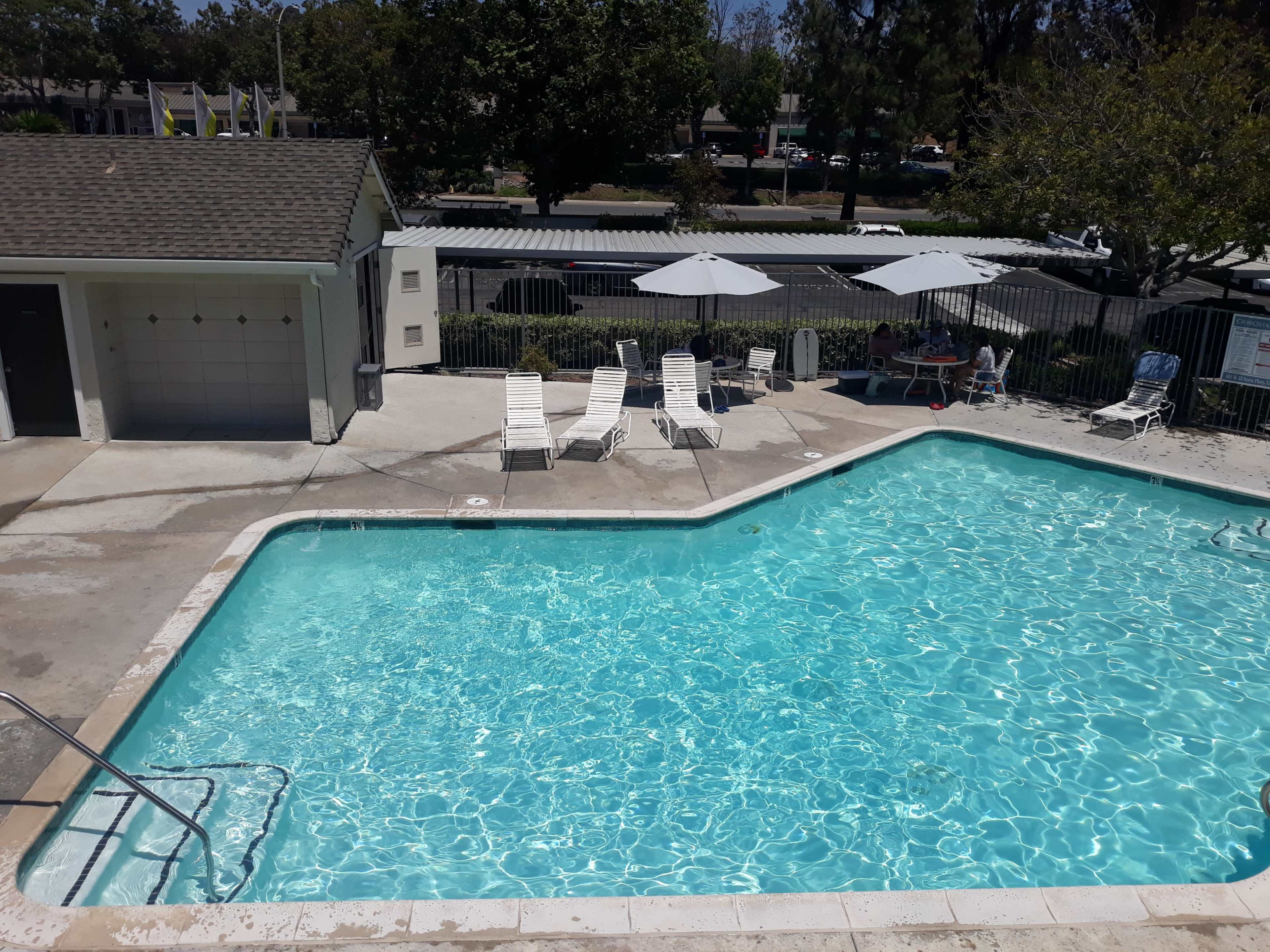 Sleek Urban Escape: High-Ceiling Apartment with Balcony & Pool Viewl Image in Central Escondido, San Diego, CA
