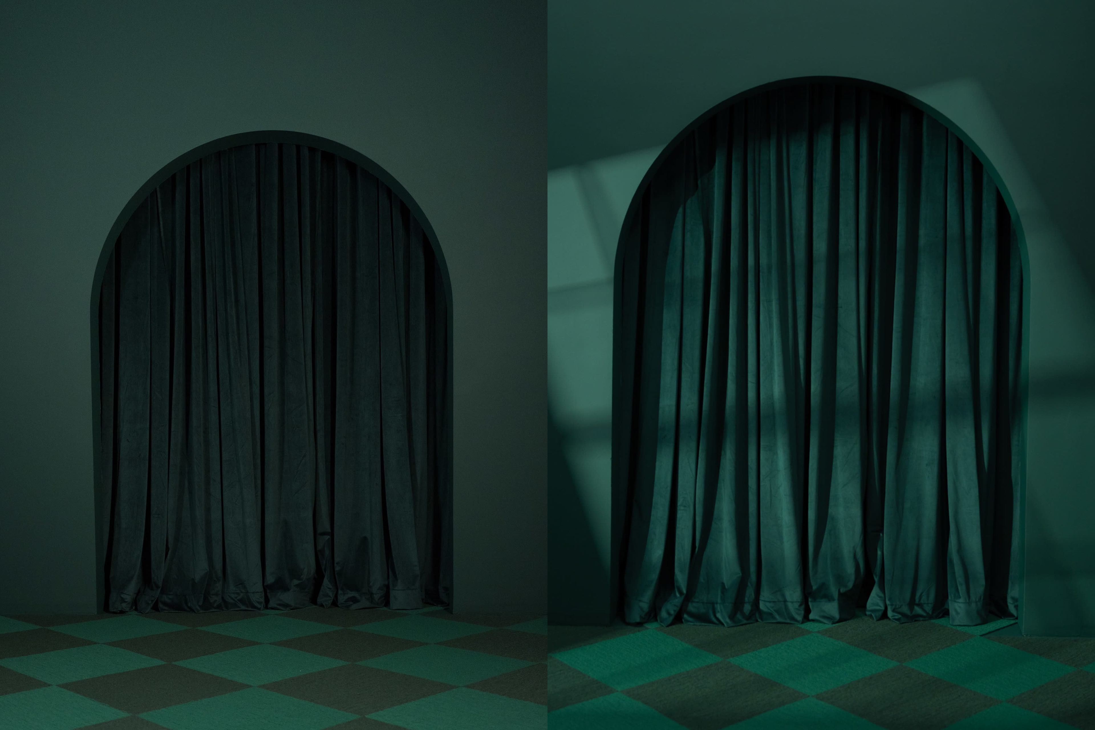 The image features two dark green velvet curtains draped in an arched opening against a similarly colored backdrop, with one curtain casting a shadow on the adjacent wall.