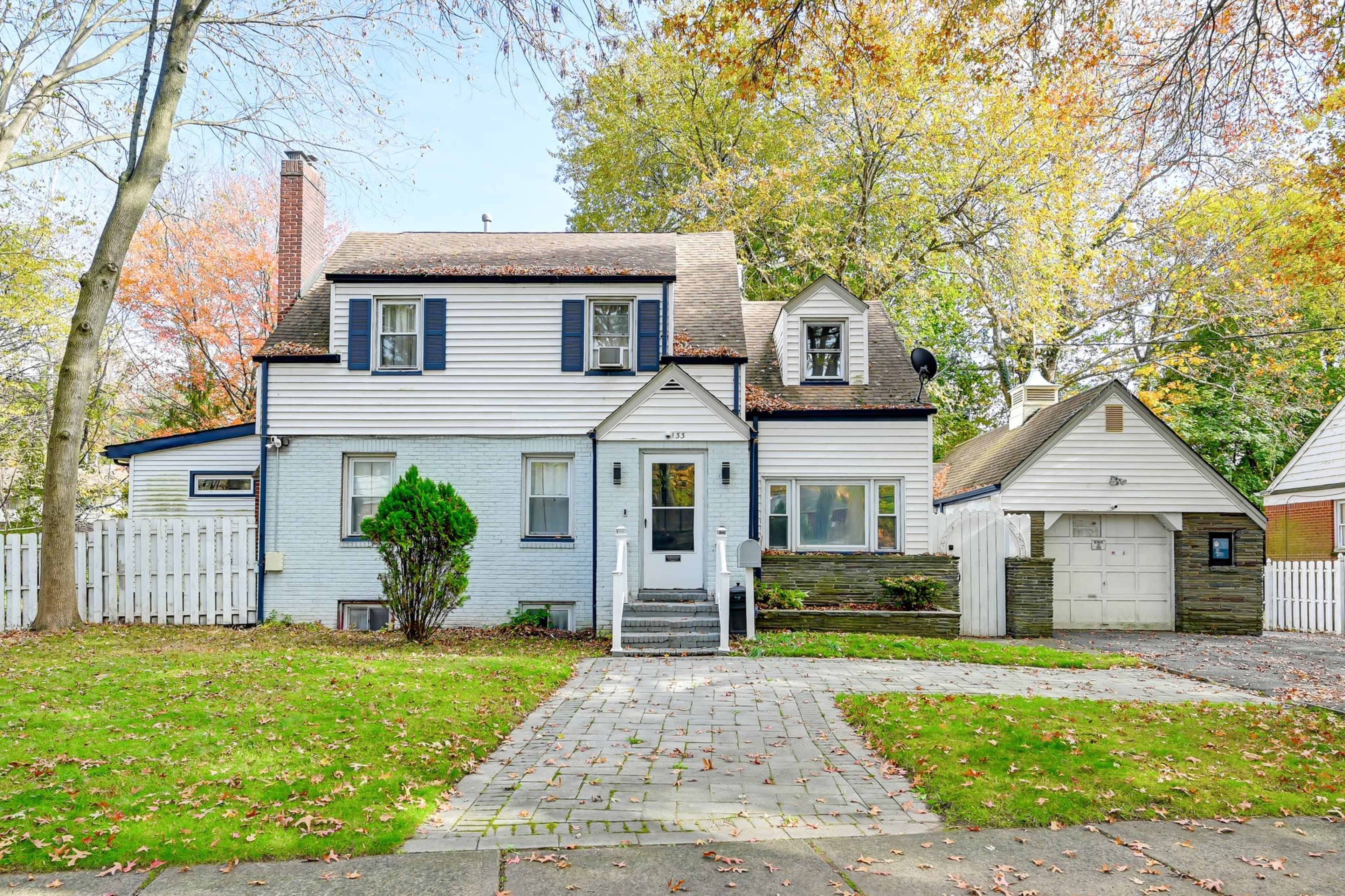 Modern Open Concept Entire single family home with basketball court and full deck in the back yard. Small creek runs as well on side of property. Image in Englewood, Englewood, NJ