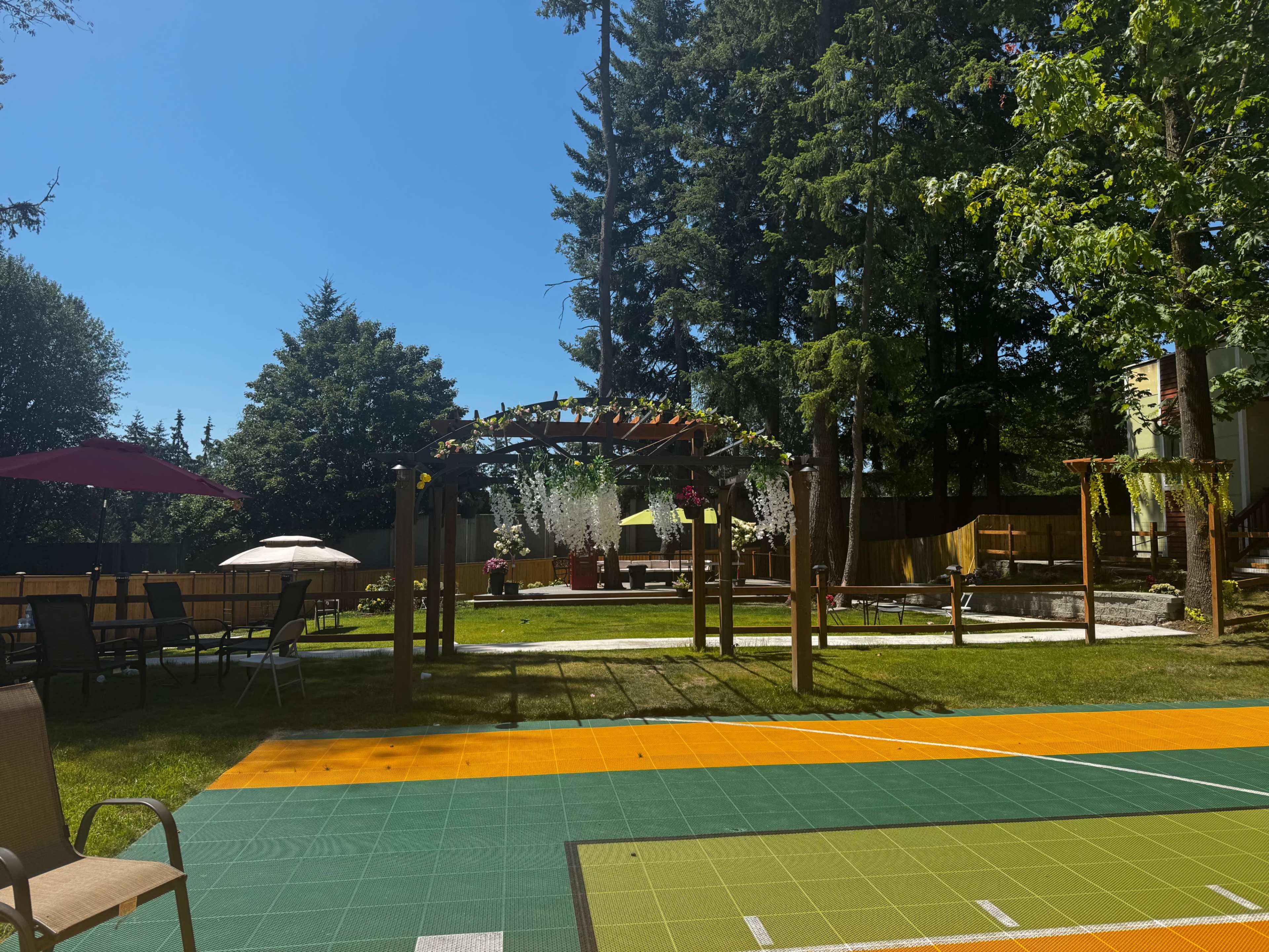 Unique back yard venue with a Basketball court, putting Green, beautiful garden and Bar. Image in Kingsgate, ne kirkland, WA
