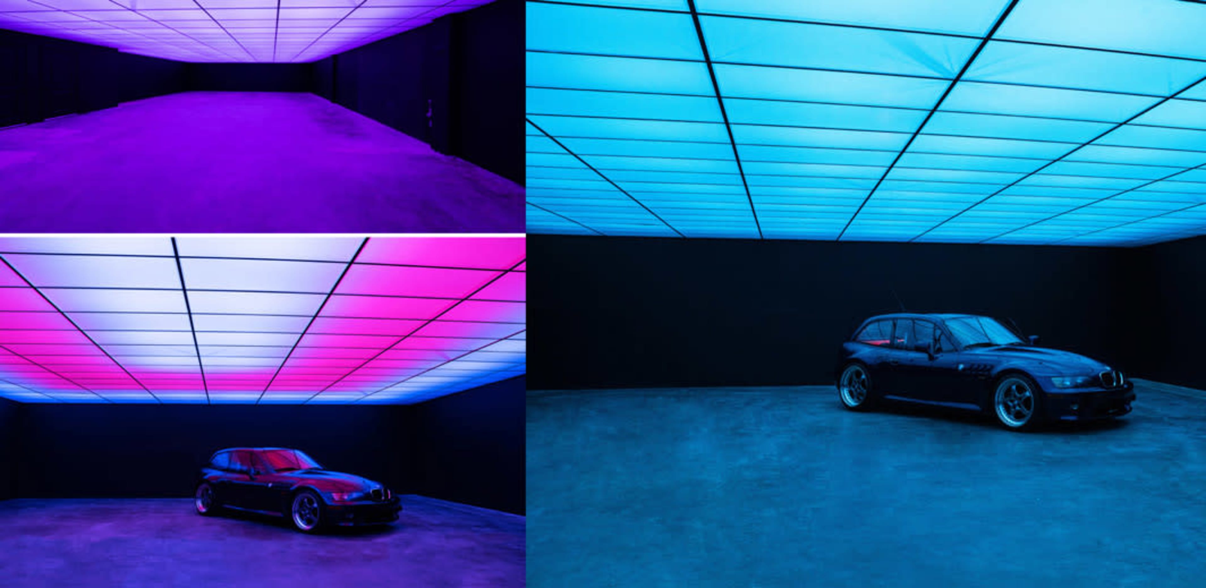 A low-lit room with a gradient-colored ceiling features a parked black car, creating a modern and minimalist atmosphere.