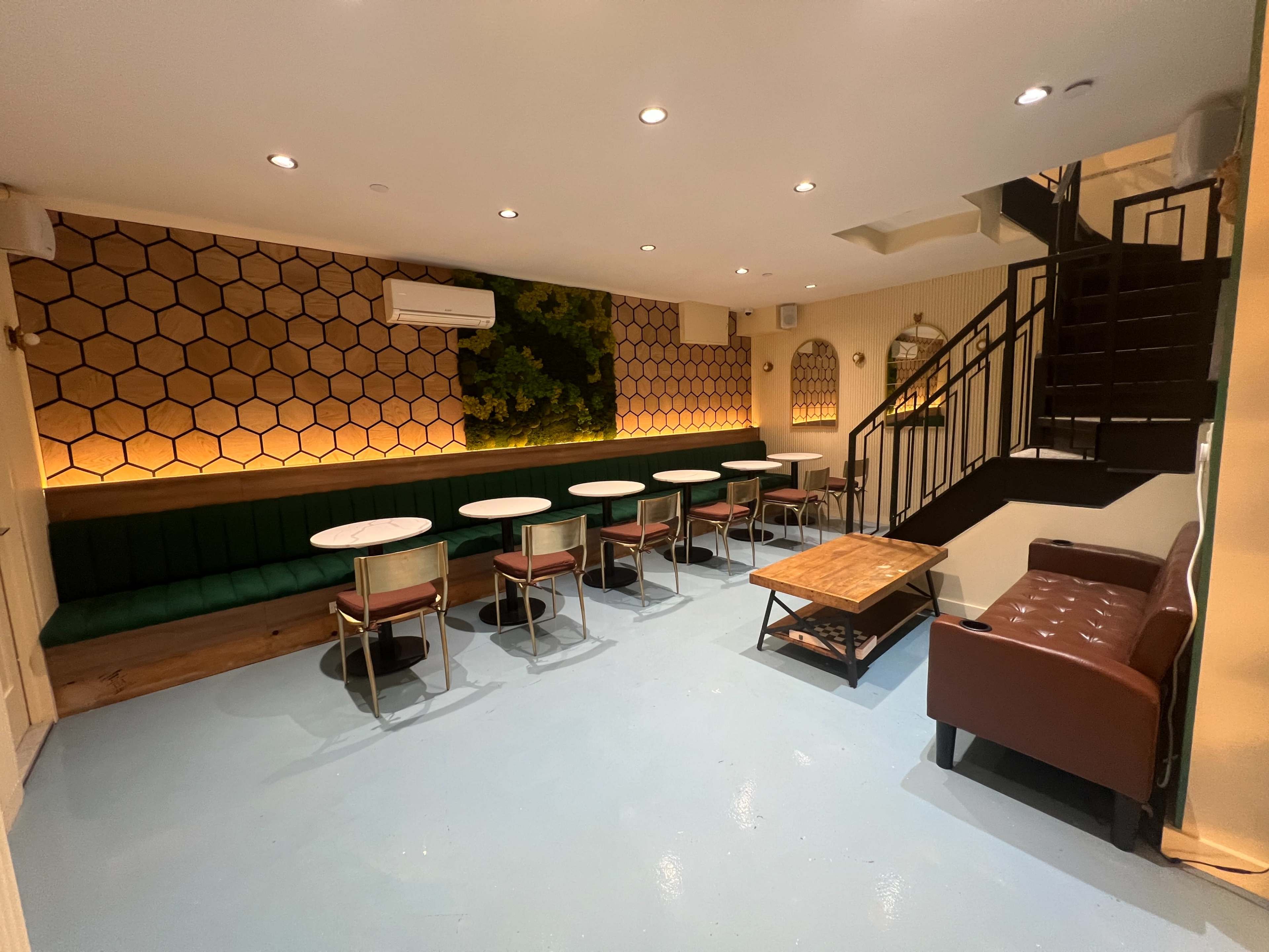 Cozy Brooklyn Lounge with Green Wall & Library Image in Sunset Park, Brooklyn, NY