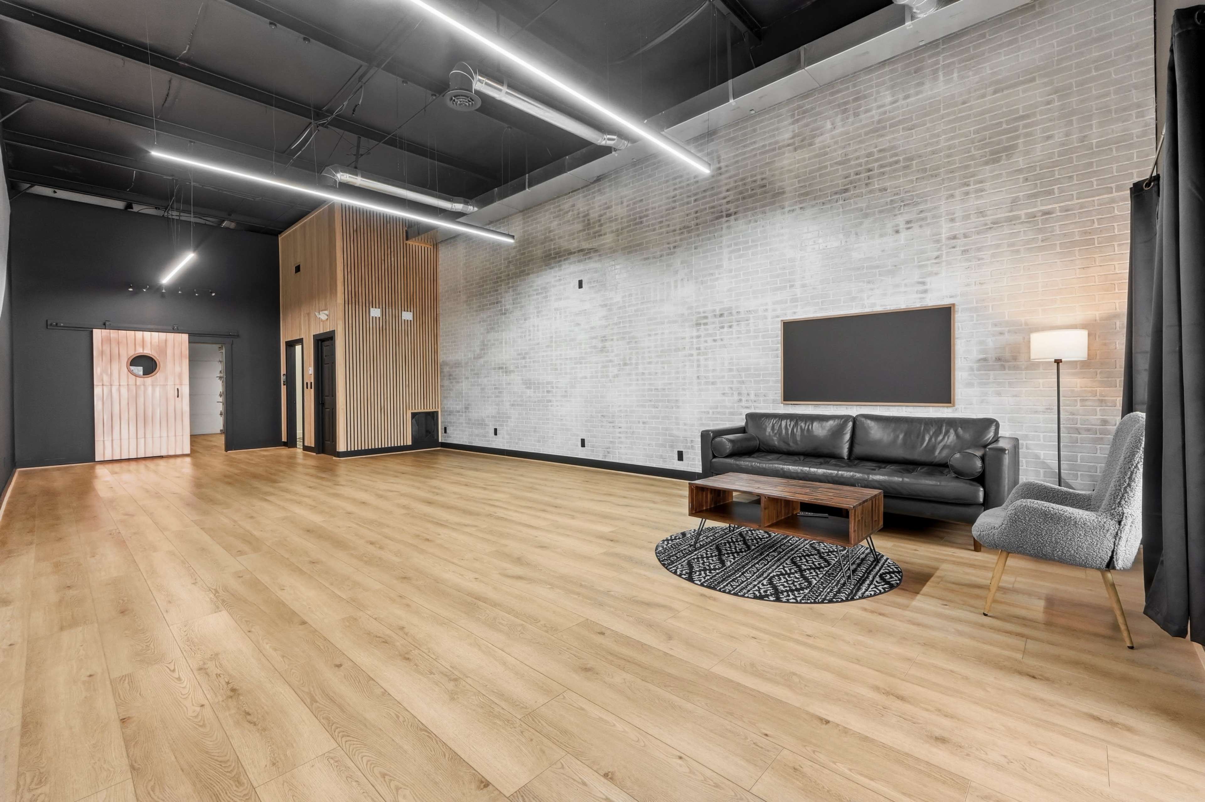 Urban Studio with Modern Wood & Brick Design in Fort Wayne Image in Washington Township, Fort Wayne, IN