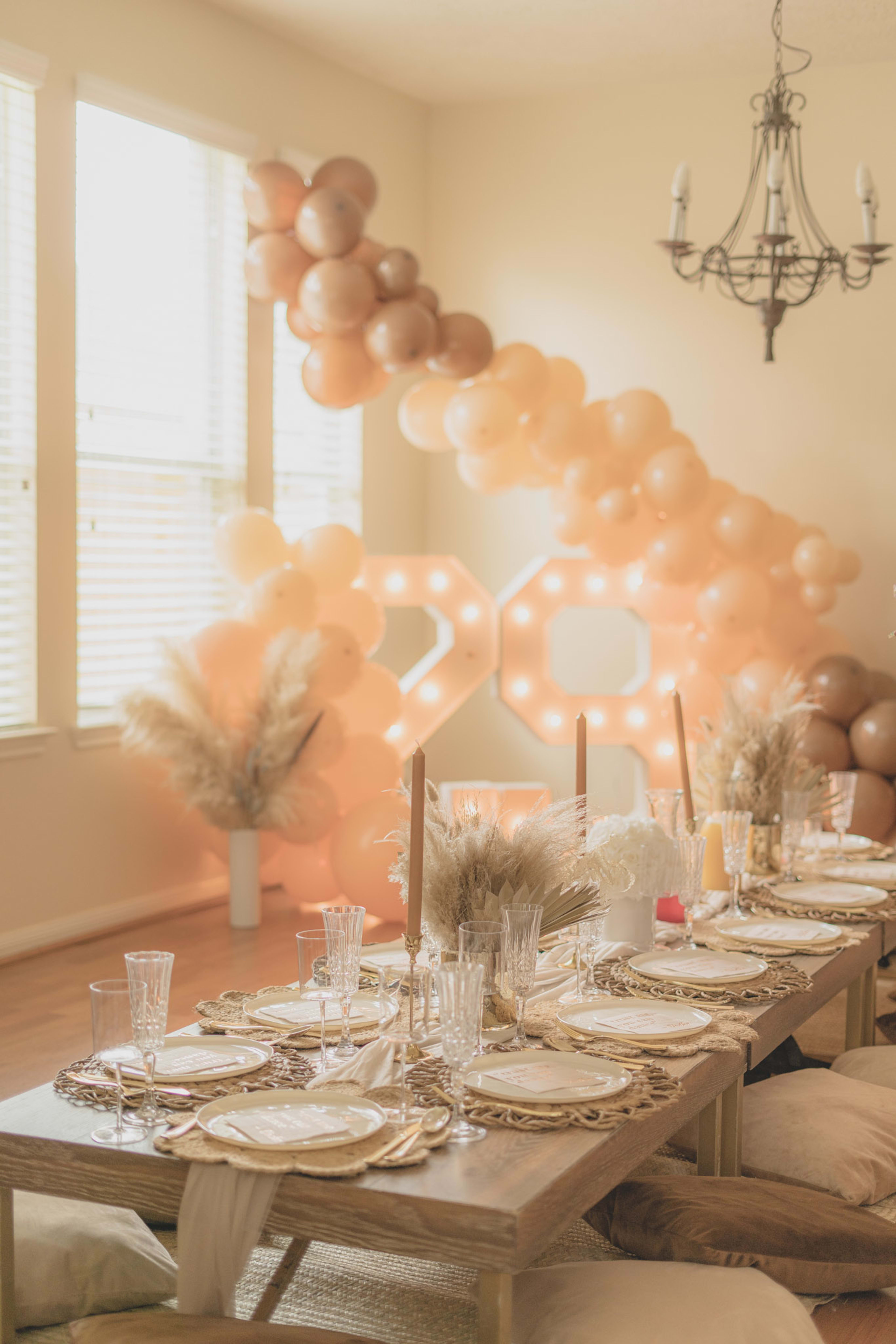 A boho dining room table set for a birthday party.