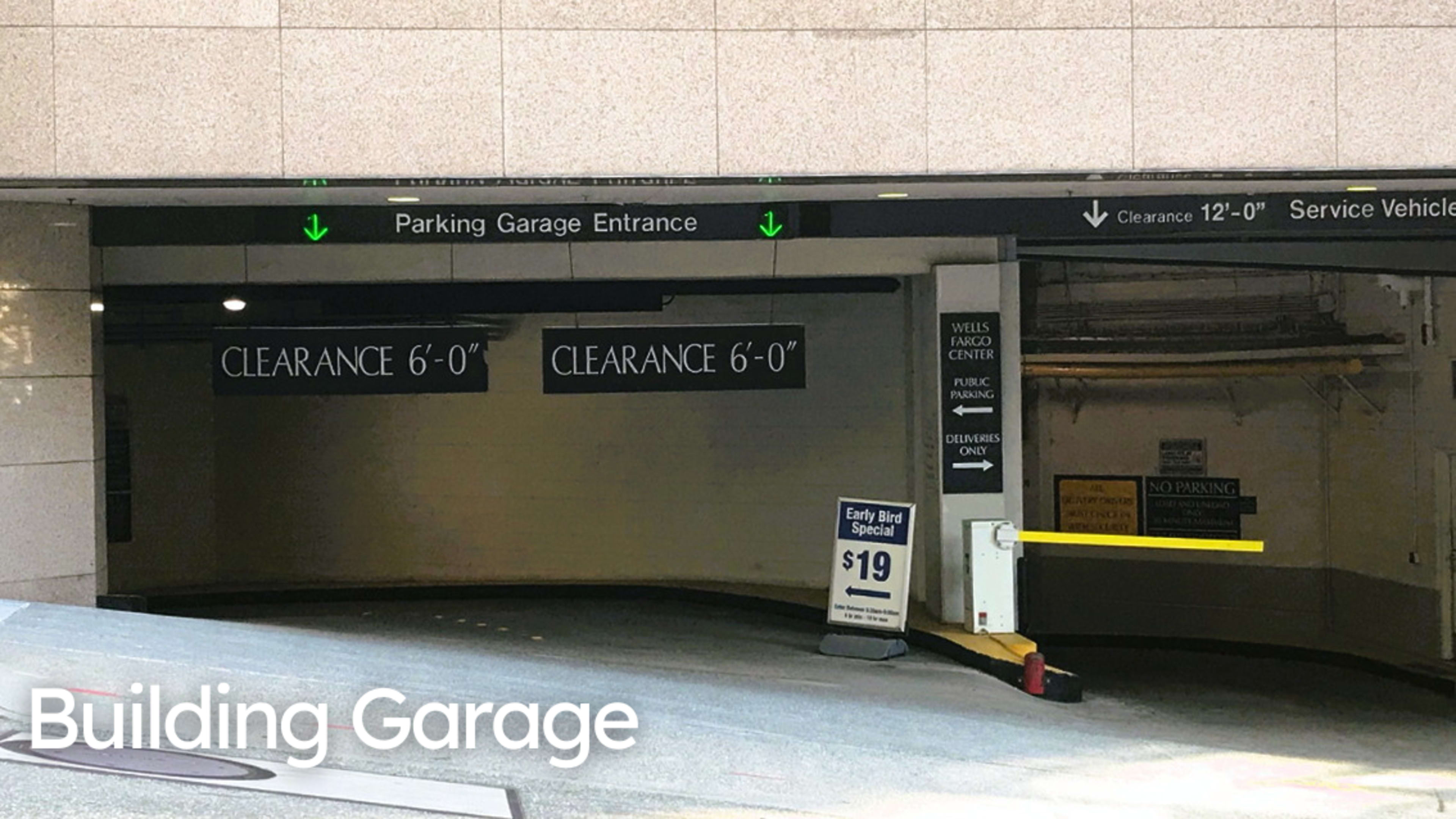 A parking garage entrance displays clearance heights and an early bird special sign.