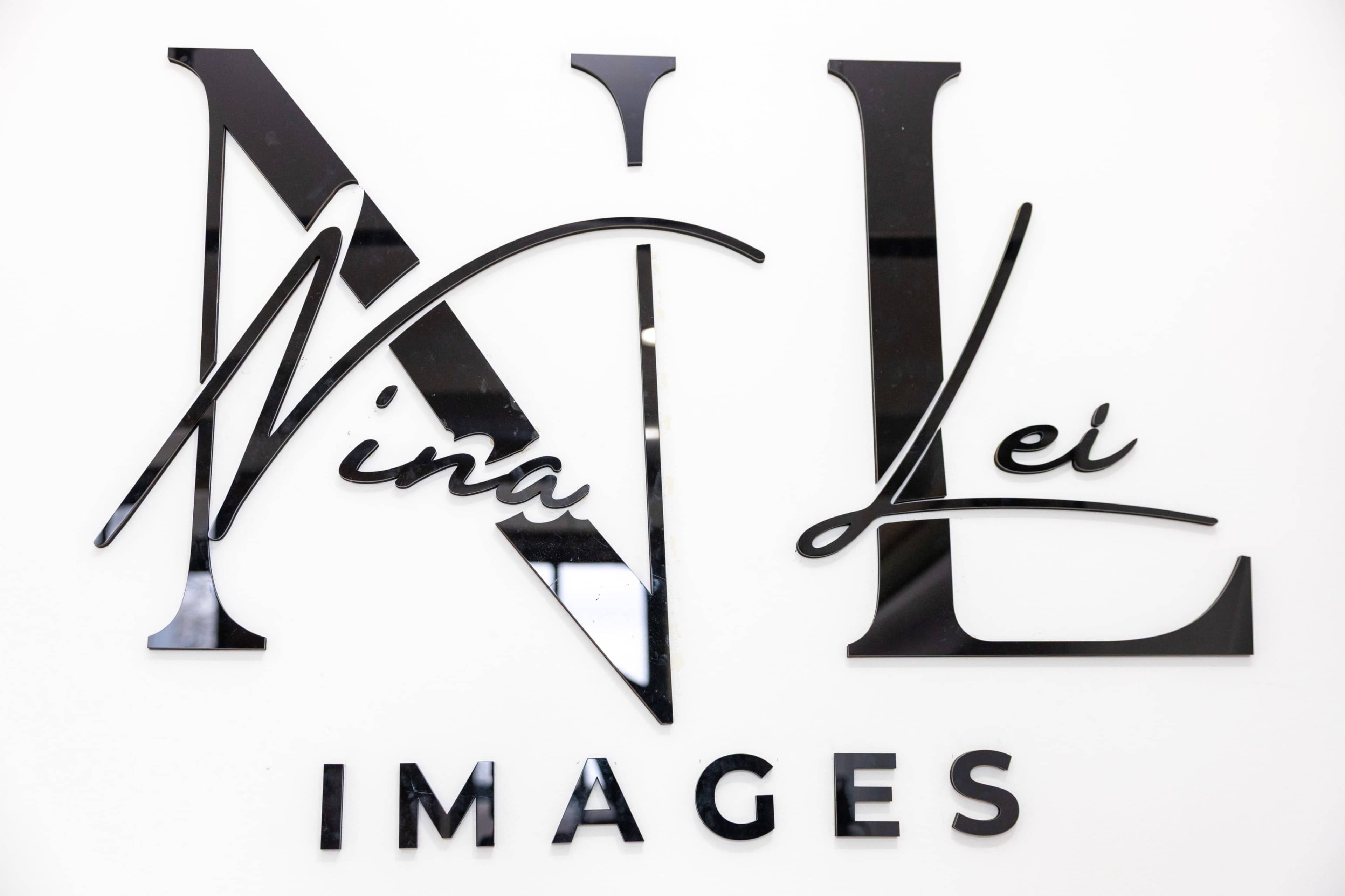 The image shows a decorative sign with the text "Nina Lei IMAGES" in a stylized font.