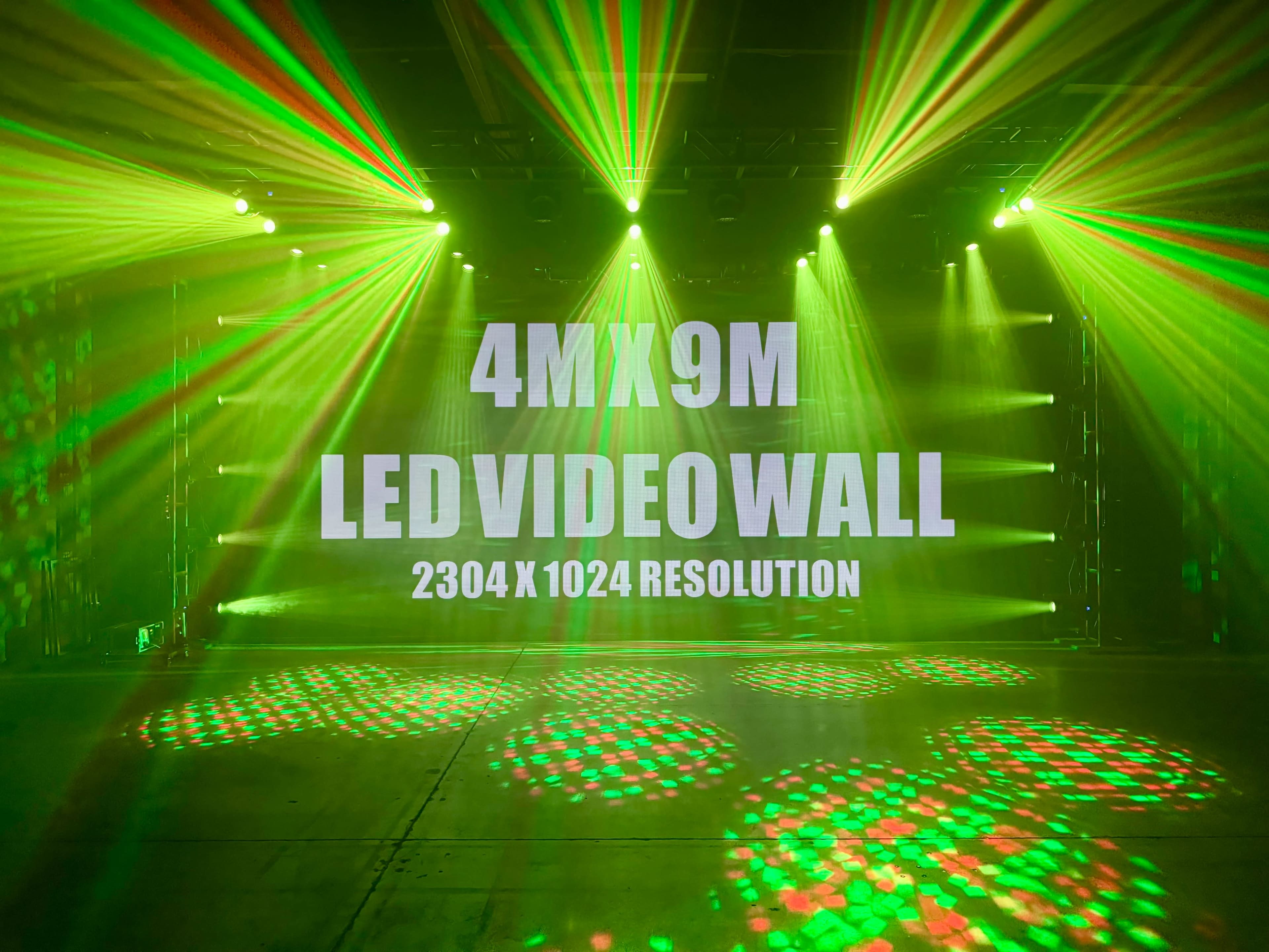 A large LED video wall measuring 4 meters by 9 meters displays the text "LED VIDEO WALL" and its resolution, surrounded by colorful stage lighting effects.