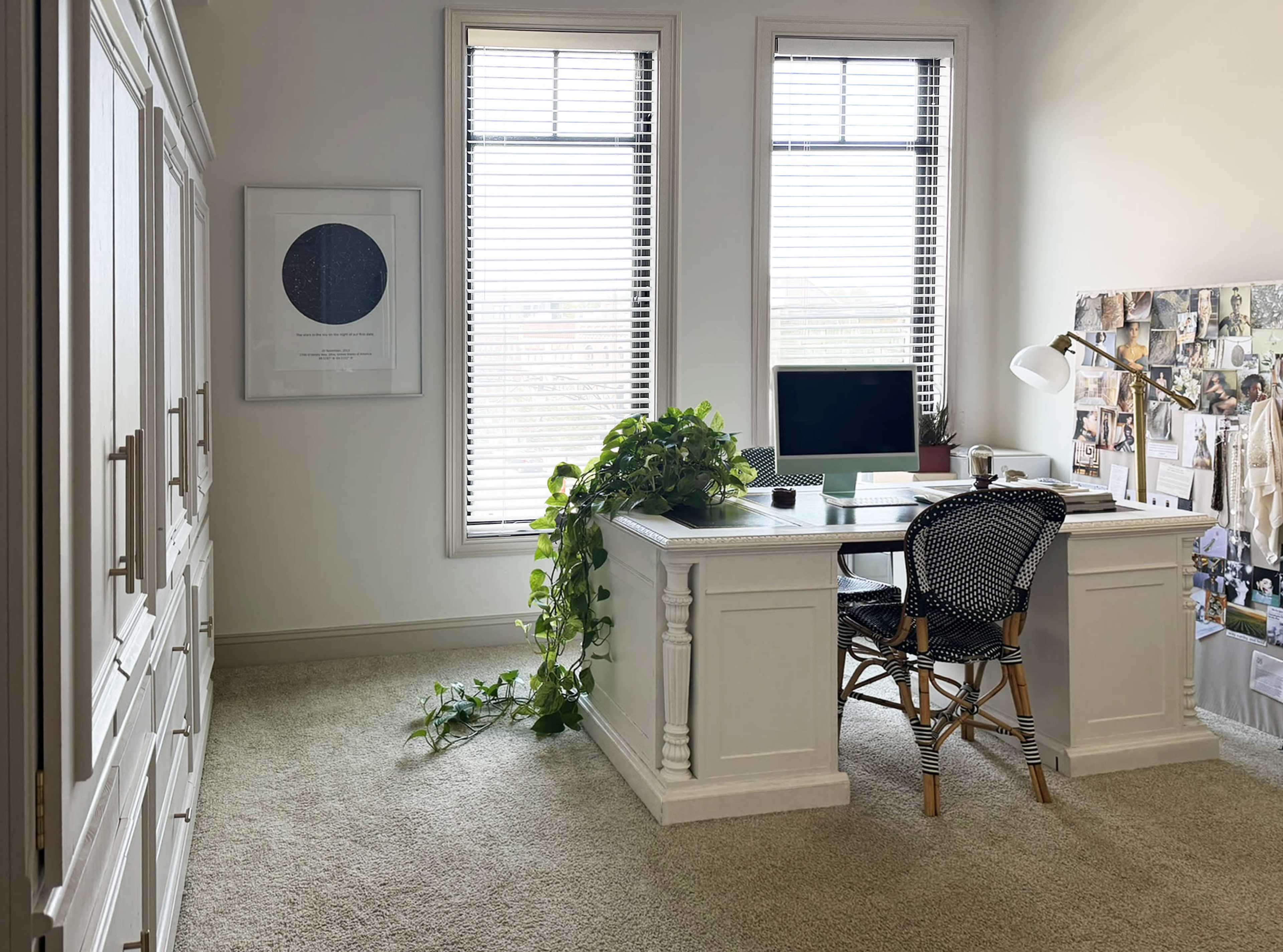 The image features a well-lit home office with a white desk, a computer, and a chair, surrounded by two windows and a wall decorated with a collage of images.