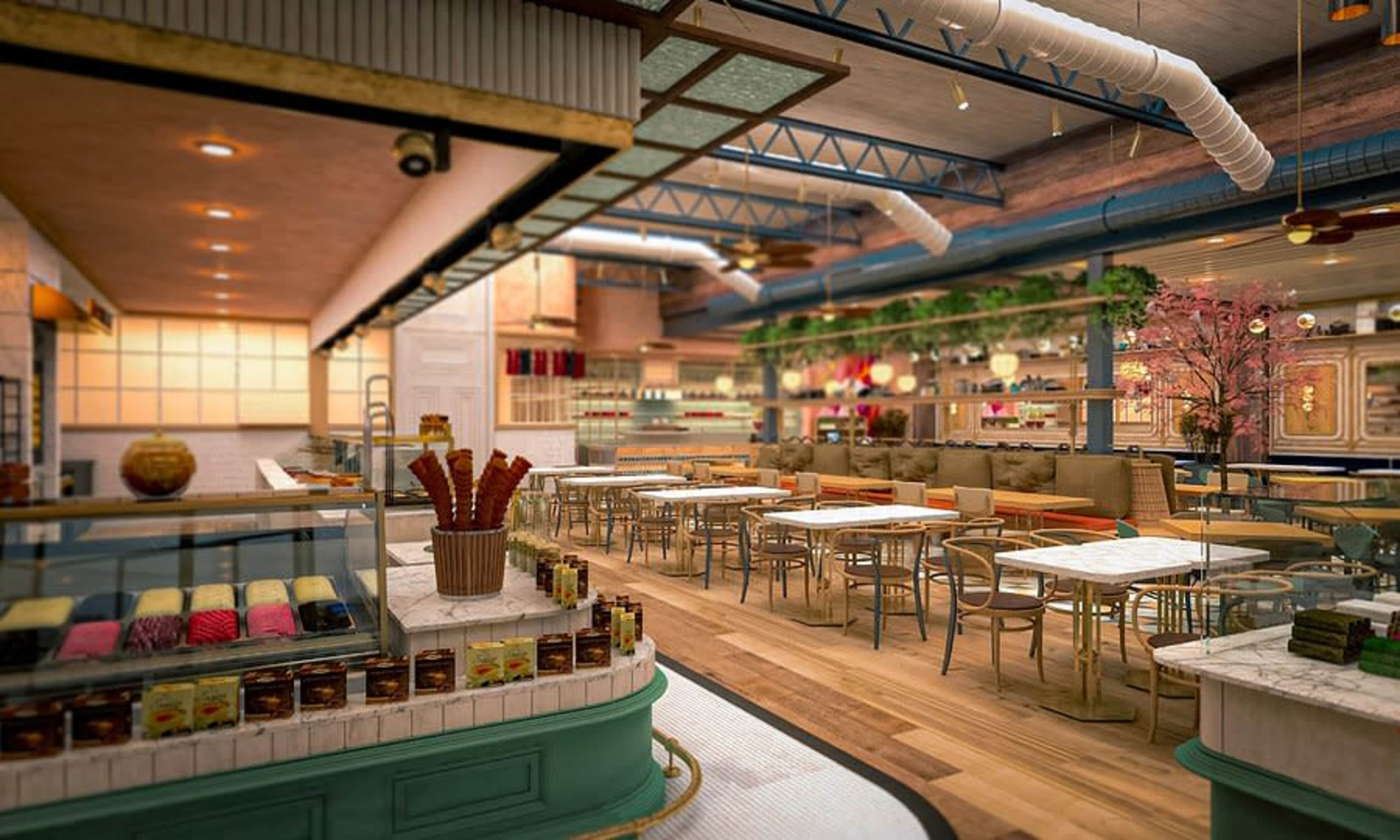 The image shows the interior of a modern restaurant featuring wooden floors, a variety of seating arrangements, and a display of desserts.