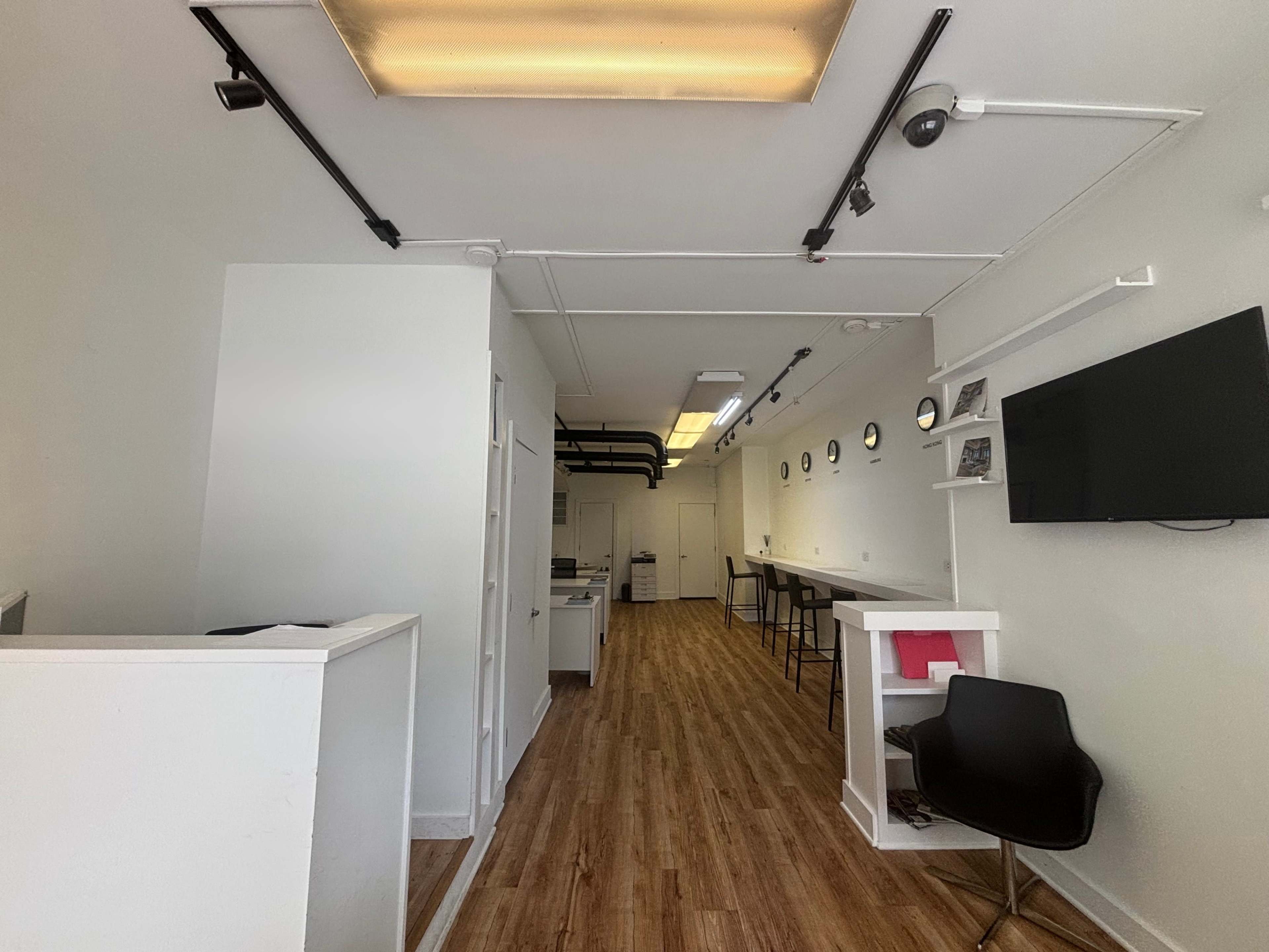 Crisp clean office space available for meetings, podcasts, photo shoots, and very small events. Image in Harsimus Cove, Jersey City, NJ