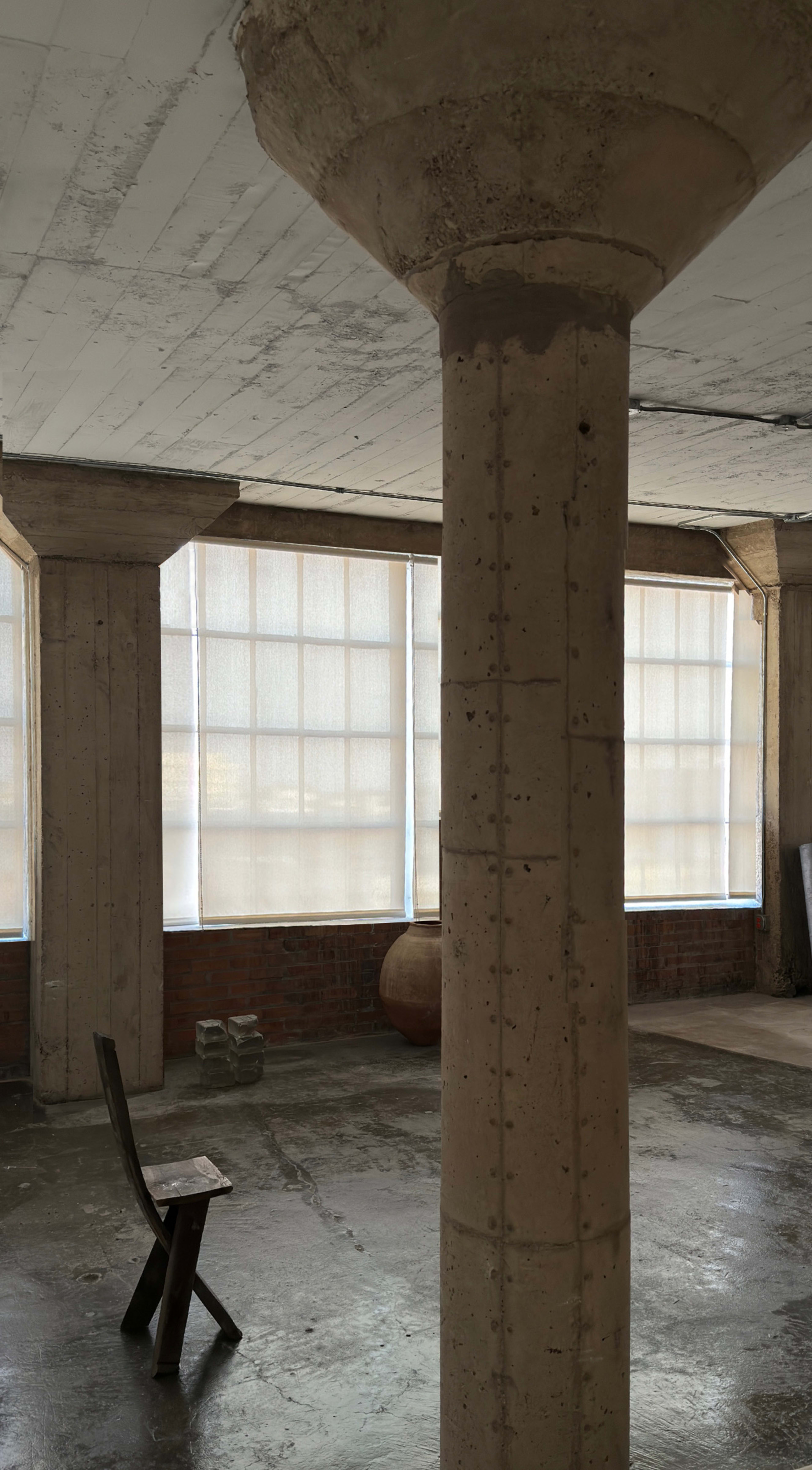 Wabi Sabi Design Loft filled with Light and Skyline View. Image in Deep Ellum, Dallas, TX