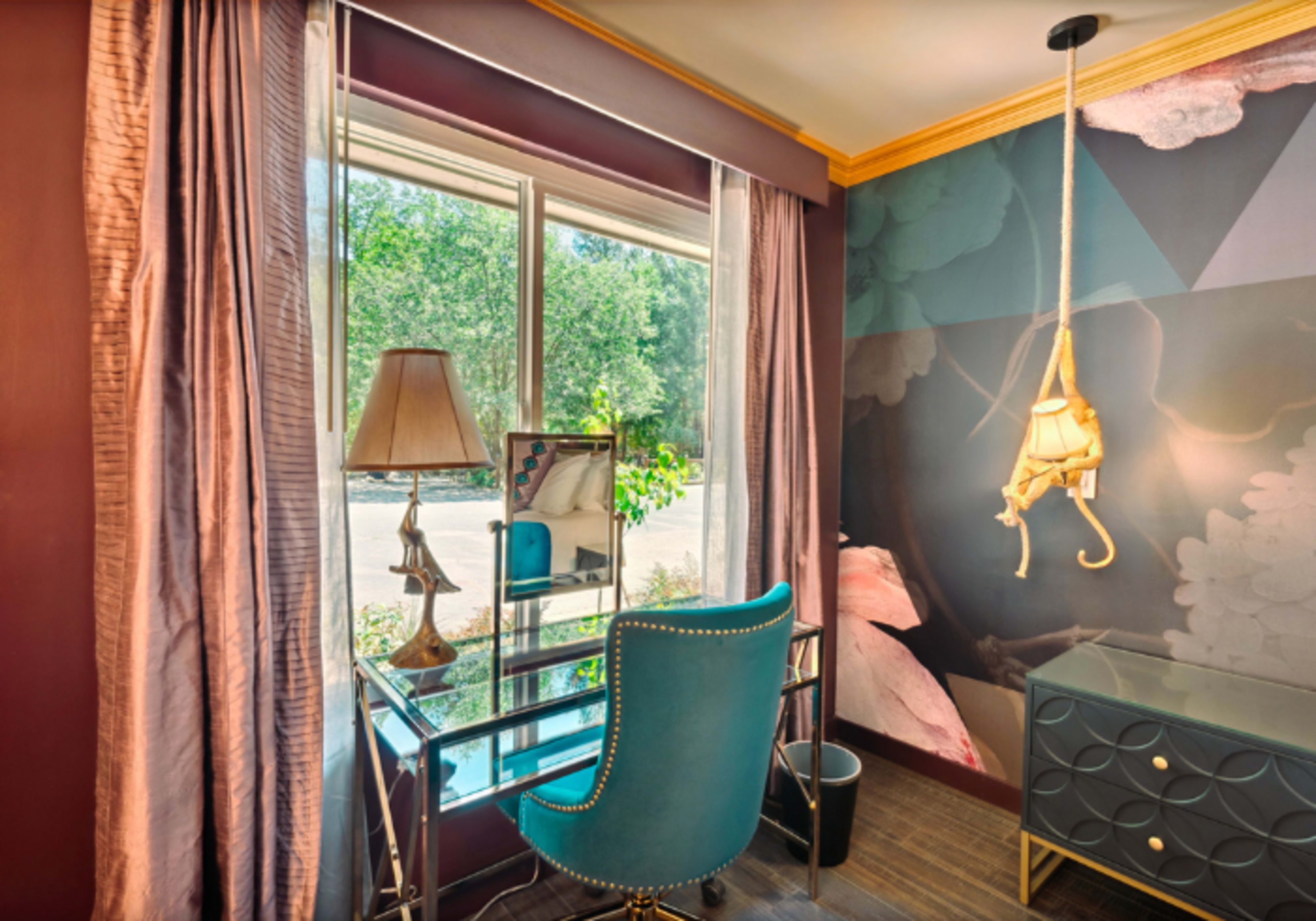 Deluxe King with Queen sleeper sofa at The Fainting Couch; Your Maximalist Boutique Hotel Image in , Cobb, CA