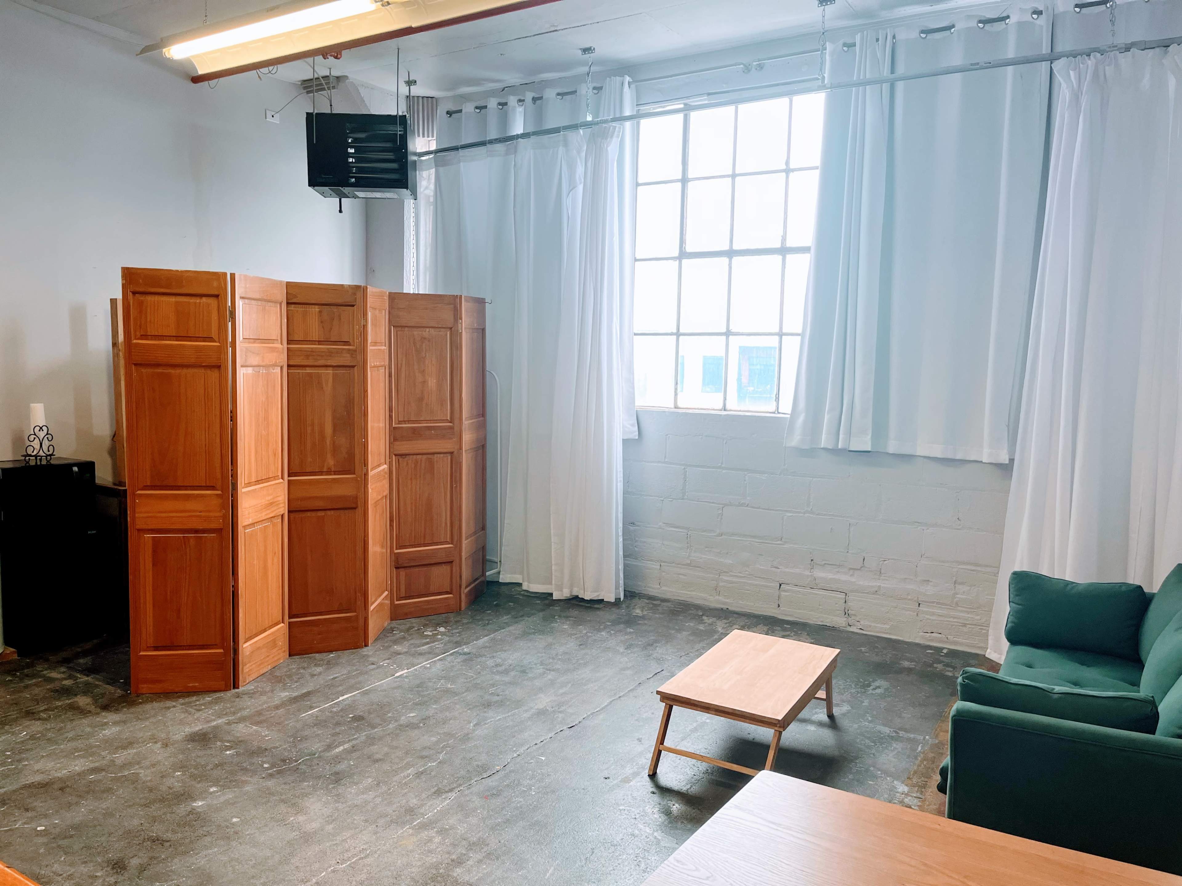 Natural Light-Filled Warehouse Studio with Harbor Skyline View Image in Bay View, Milwaukee, WI